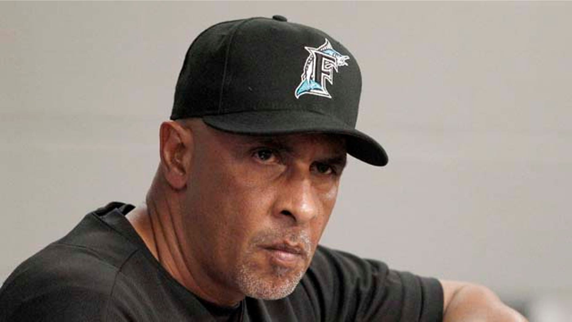 In this June 6, 2011, photo, Florida Marlins manager Edwin Rodriguez watches from the dugout during a baseball game against the Milwaukee Brewers in Miami. Rodriguez, the first Puerto Rican-born manager in major league history, unexpectedly resigned Sunday, June 19, 2011. after less than one year on the job. (AP Photo/Lynne Sladky)