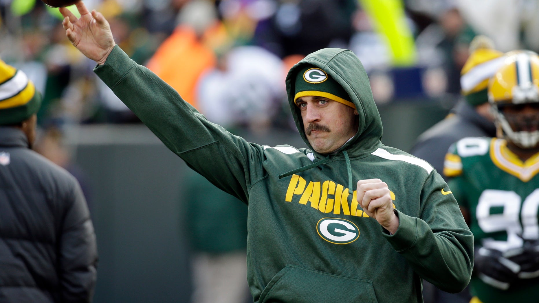 Green Bay Packers' Aaron Rodgers throws before an NFL football game against the Minnesota Vikings Sunday, Nov. 24, 2013, in Green Bay, Wis. (AP Photo/Mike Roemer)