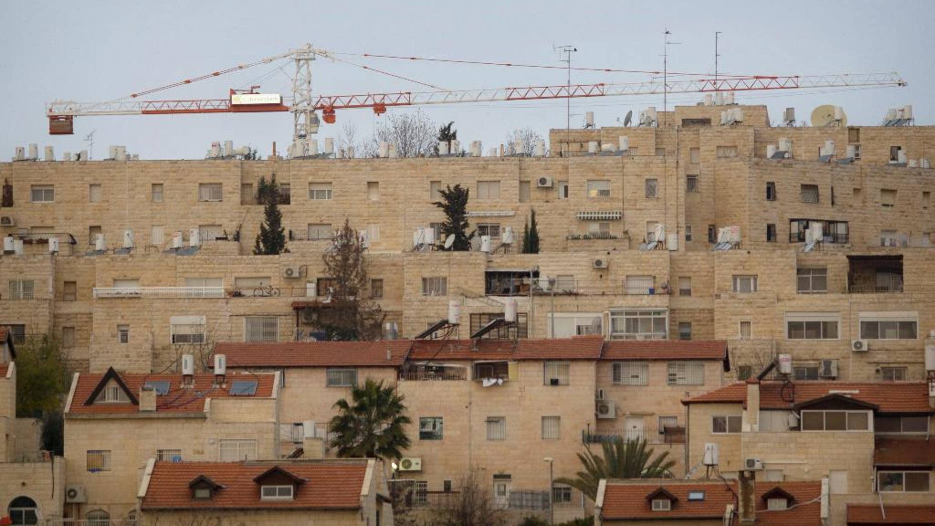 FILE - In this Jan. 16, 2011 file photo construction cranes are seen at the Jewish neighborhood of Gilo in Jerusalem. A Jerusalem city official says authorities have pushed forward plans to build 181 new homes in east Jerusalem Gilo area. srael captured east Jerusalem and the West Bank in 1967. Israel subsequently annexed east Jerusalem and considers areas like Gilo to be neighborhoods of its capital. The Palestinians claim east Jerusalem as their future capital, and most of the world considers settlement construction there and in the West Bank illegal or illegitimate. (AP Photo/Sebastian Scheiner, file)