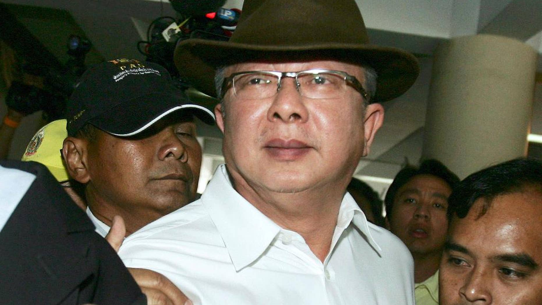 FILE - In this July 24, 2008, file photo, Sondhi Limthongkul, founder of Thailand's People's Alliance for Democracy, arrives at the metropolitan police headquarters to acknowledge the police charges for lese majesty in Bangkok, Thailand. Thailand's Supreme Court on Tuesday, Sept. 6, 2016, upheld a 20-year prison sentence for fraud for the media tycoon whose crusade to oust a prime minister succeeded, triggering a decade of political violence and instability. The court affirmed a lower court's 2012 ruling that Sondhi violated Securities and Exchange Commission regulations in 1996-97 by presenting fraudulent financial data to obtain a large bank loan for one of his businesses.(AP Photo/Sakchai Lalit, File)