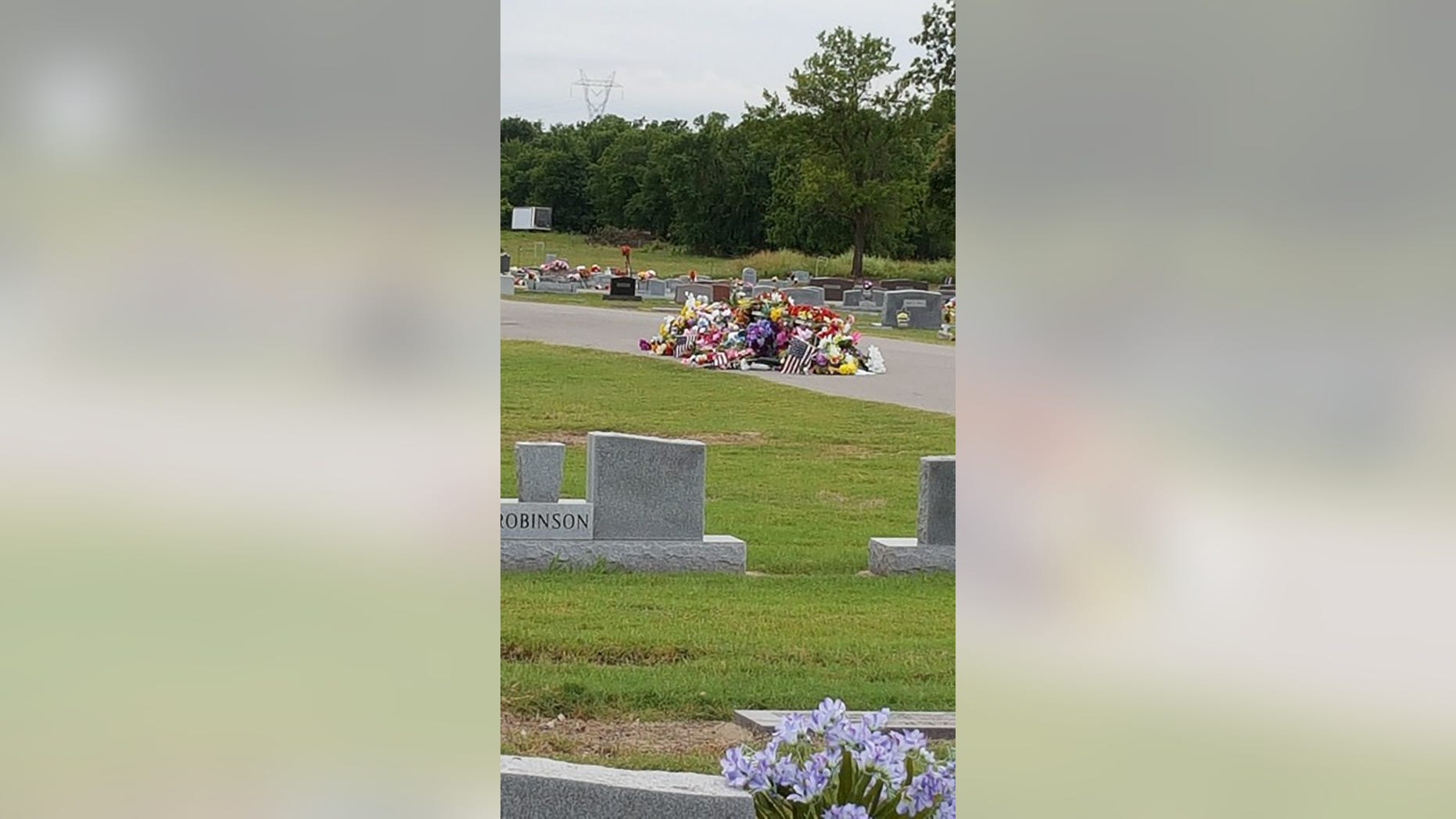 The flags were seen in a giant pile on the ground at Bixby Cemetery in Oklahoma.