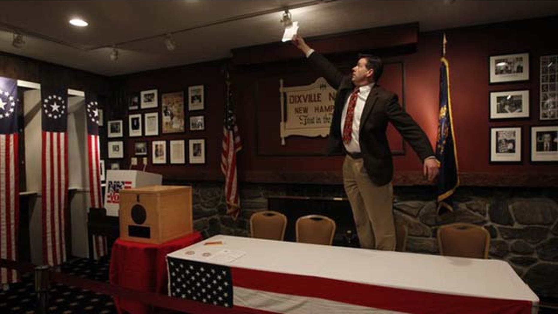 January 10, 2012: Scott Trachemontagne adjusts a light in the "Ballot Room" of the Balsams Hotel in Dixville Notch, New Hampshire.