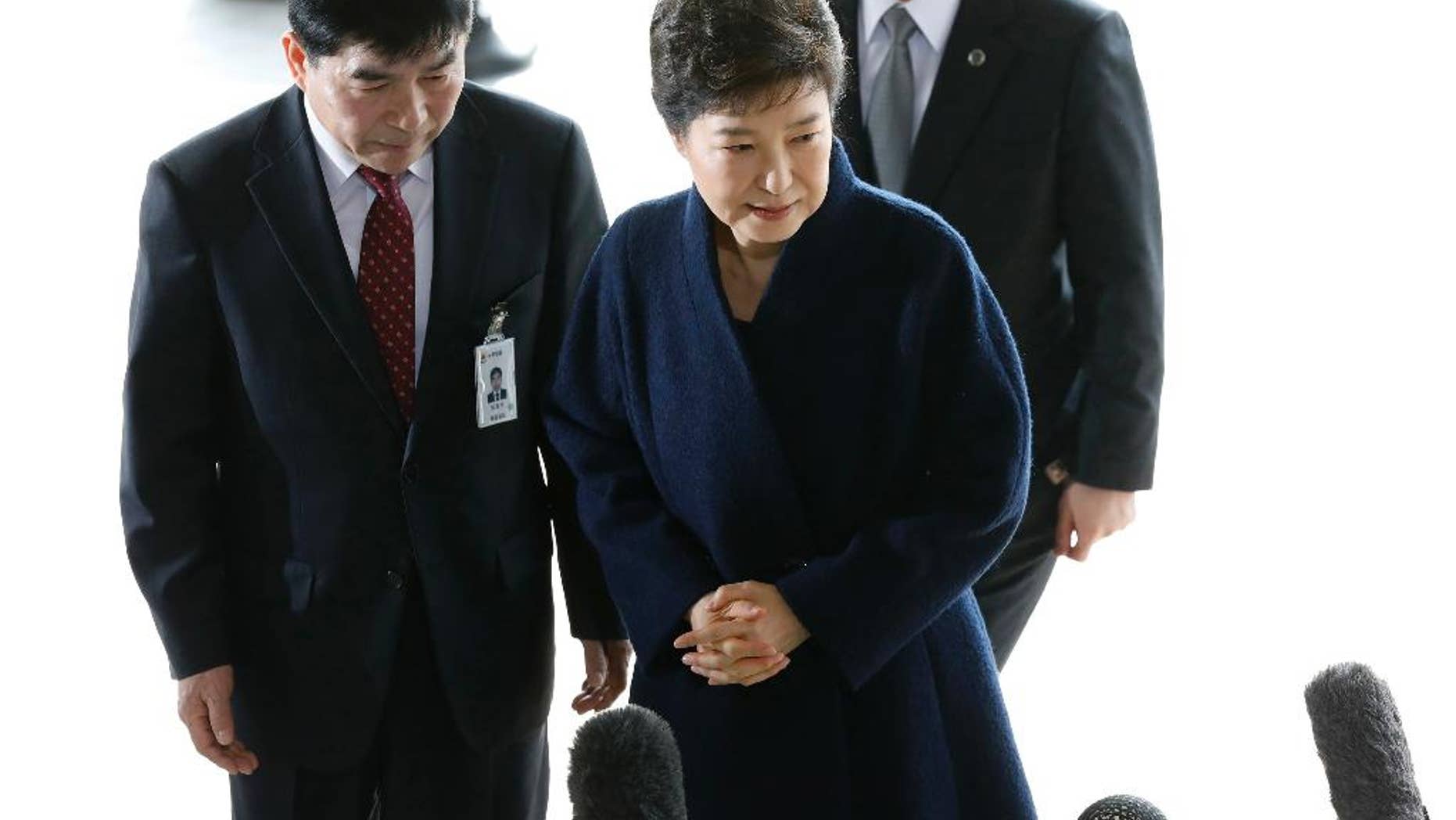FILE - In this Tuesday, March, 21, 2017 file photo, South Korea's ousted leader Park Geun-hye arrives at a prosecutor's office in Seoul, South Korea. Park has decided to attend a questioning session by a Seoul court before it determines whether she should be arrested over explosive corruption allegations, prosecutors said Tuesday, March 28. (Kim Hong-ji/Pool Photo via AP, File)