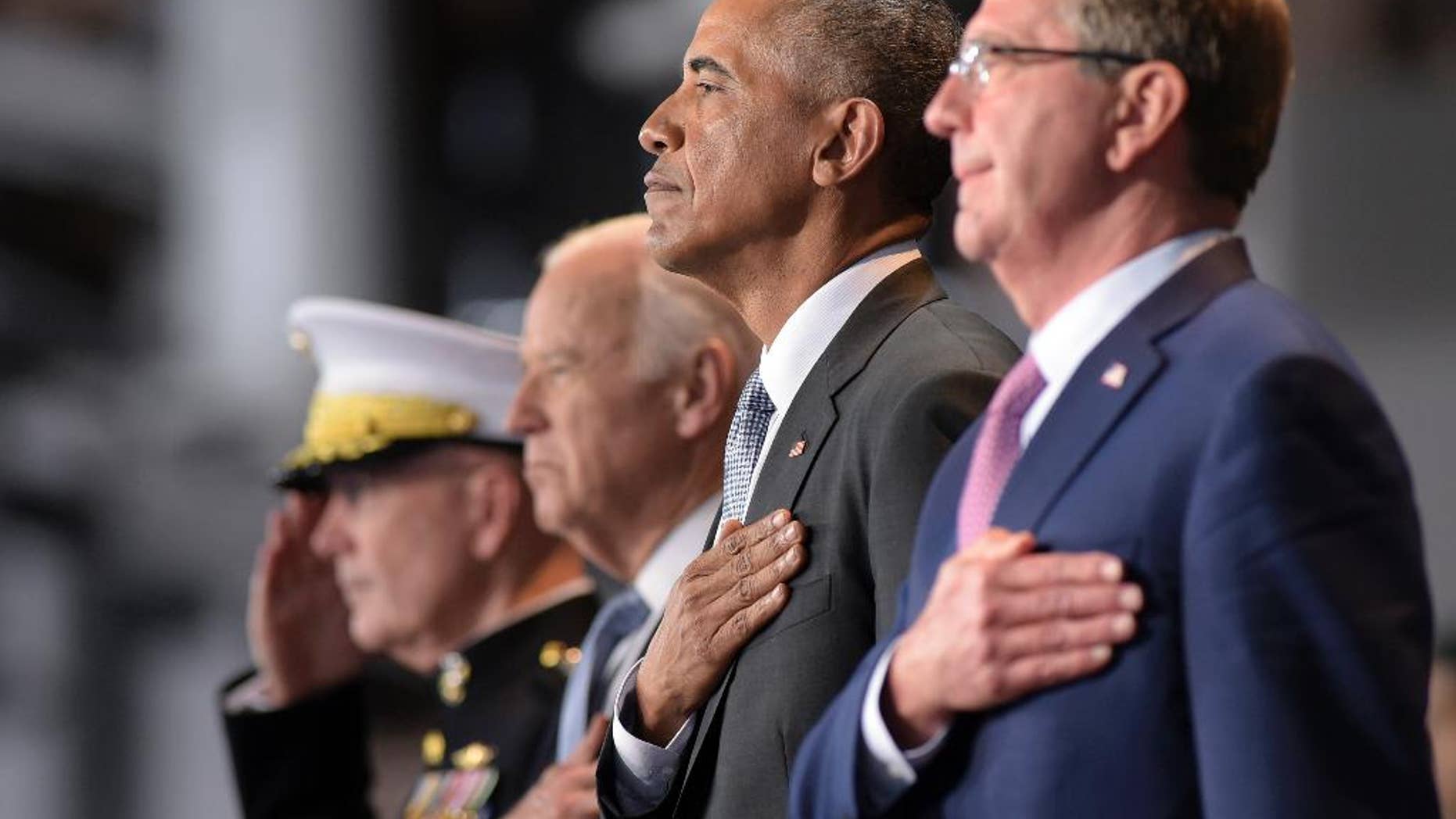 President Barack Obama, stands with, from left, Joint Chiefs Chairman Gen. Joseph Dunford, Vice President Joe Biden, and Defense Secretary Ash Carter, as they listen to the National Anthem during an Armed Forces Full Honor Farewell Review for the president, Wednesday, Jan. 4, 2017, at Conmy Hall, Joint Base Myer-Henderson Hall, Va. (AP Photo/Susan Walsh)