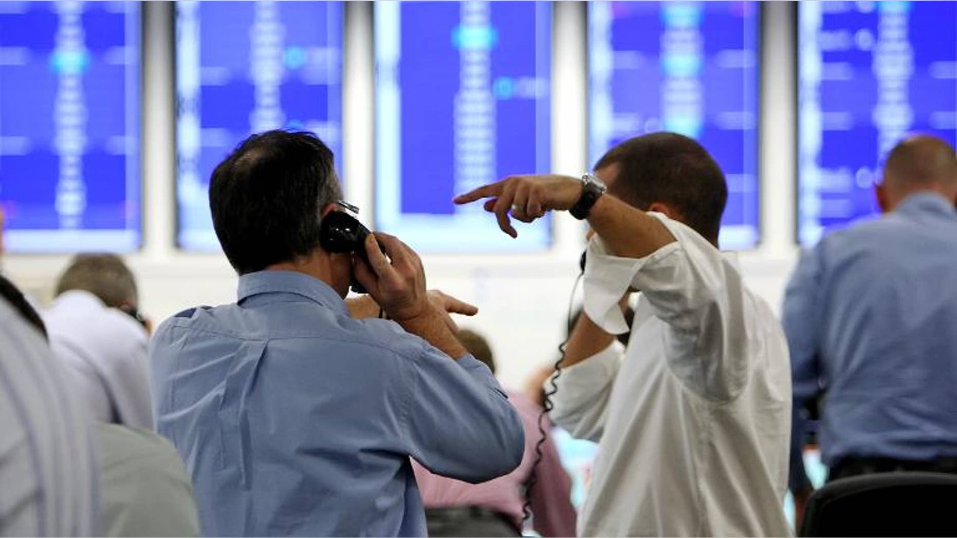 Brokers on ICAP's dealing floor, in London, on October 8, 2008.