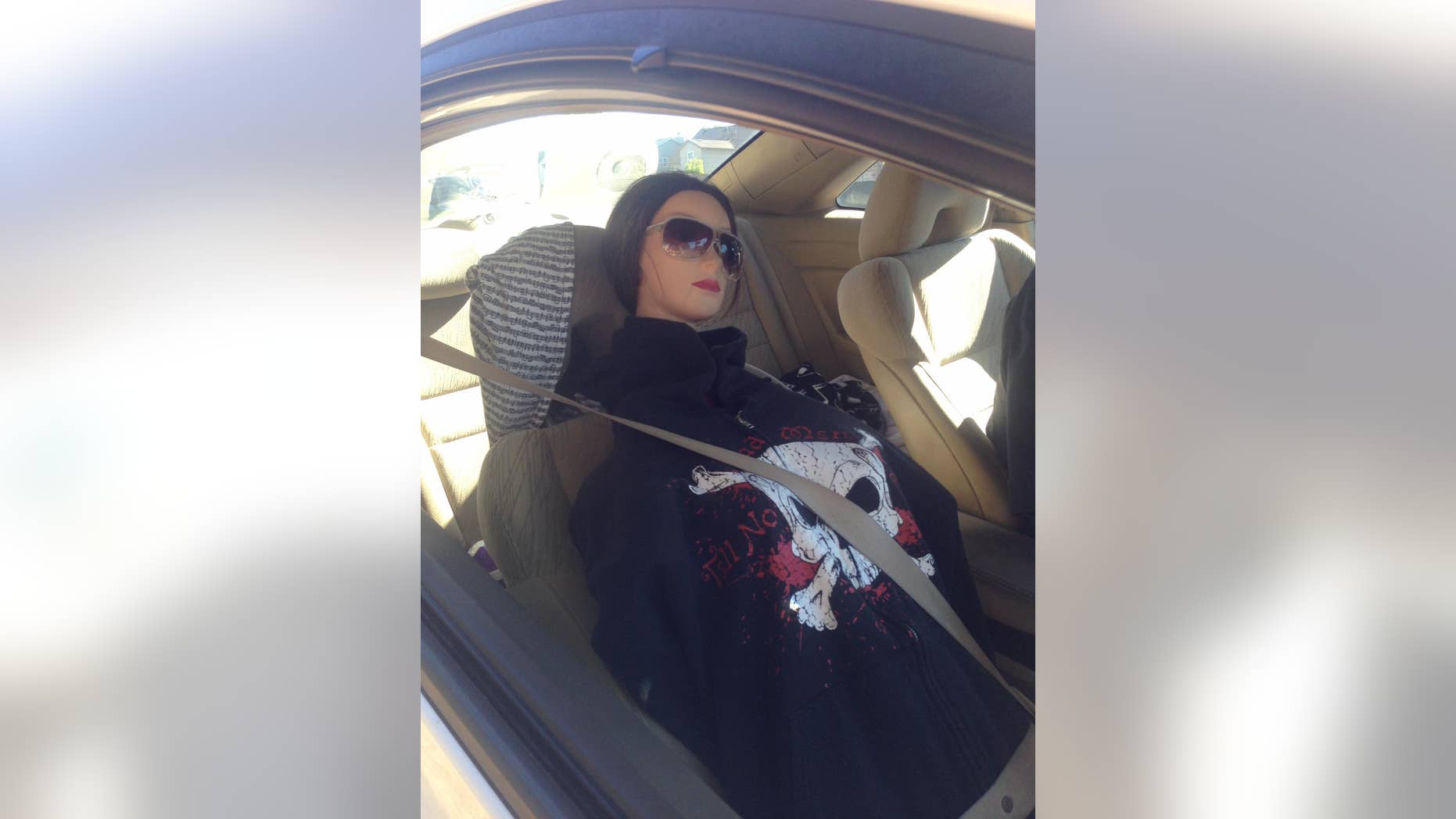 A man driving a mannequin disguised as a woman wearing a black hoodie with a skull was busted for driving in the carpool lane on a California highway. (CHP - Santa Rosa)