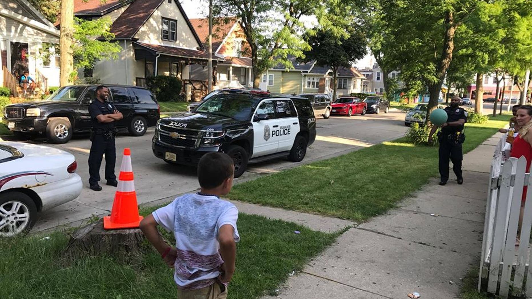Jordan McClelland and Milwaukee Police Officers playing 'cans.'