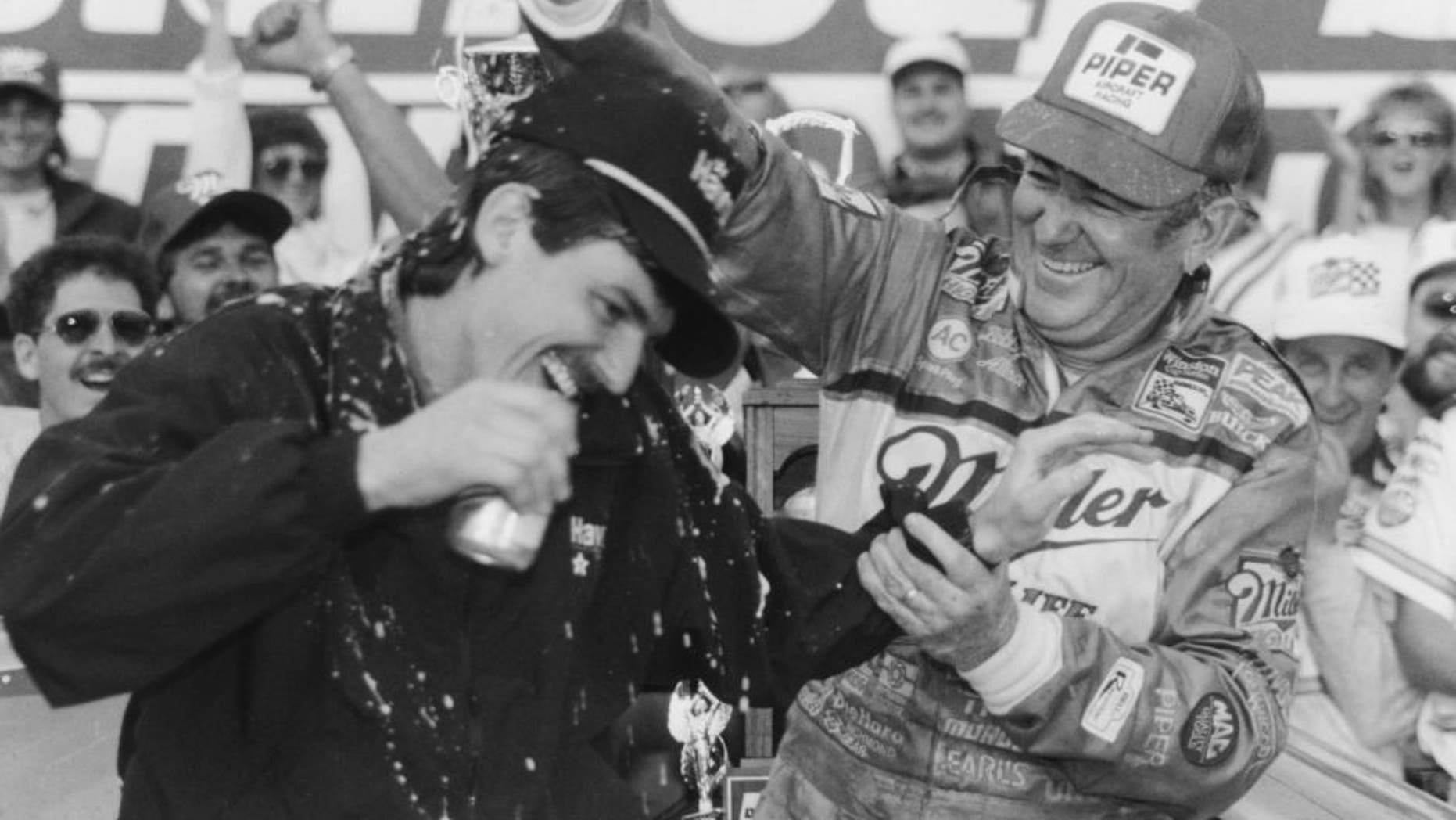 DAYTONA BEACH, FL - FEBRUARY 14: Bobby Allison driver of the #12 Buick celebrates with his son Davey (Feb 25, 1961-July 13, 1993) driver of the Robert Yates Racing #28 Texaco-Havoline Ford after winning the 1988 NASCAR Winston Cup Daytona 500 at the Daytona International Speedway on February 14, 1988 in Daytona Beach, Florida. (Photo by ISC Archives via Getty Images)