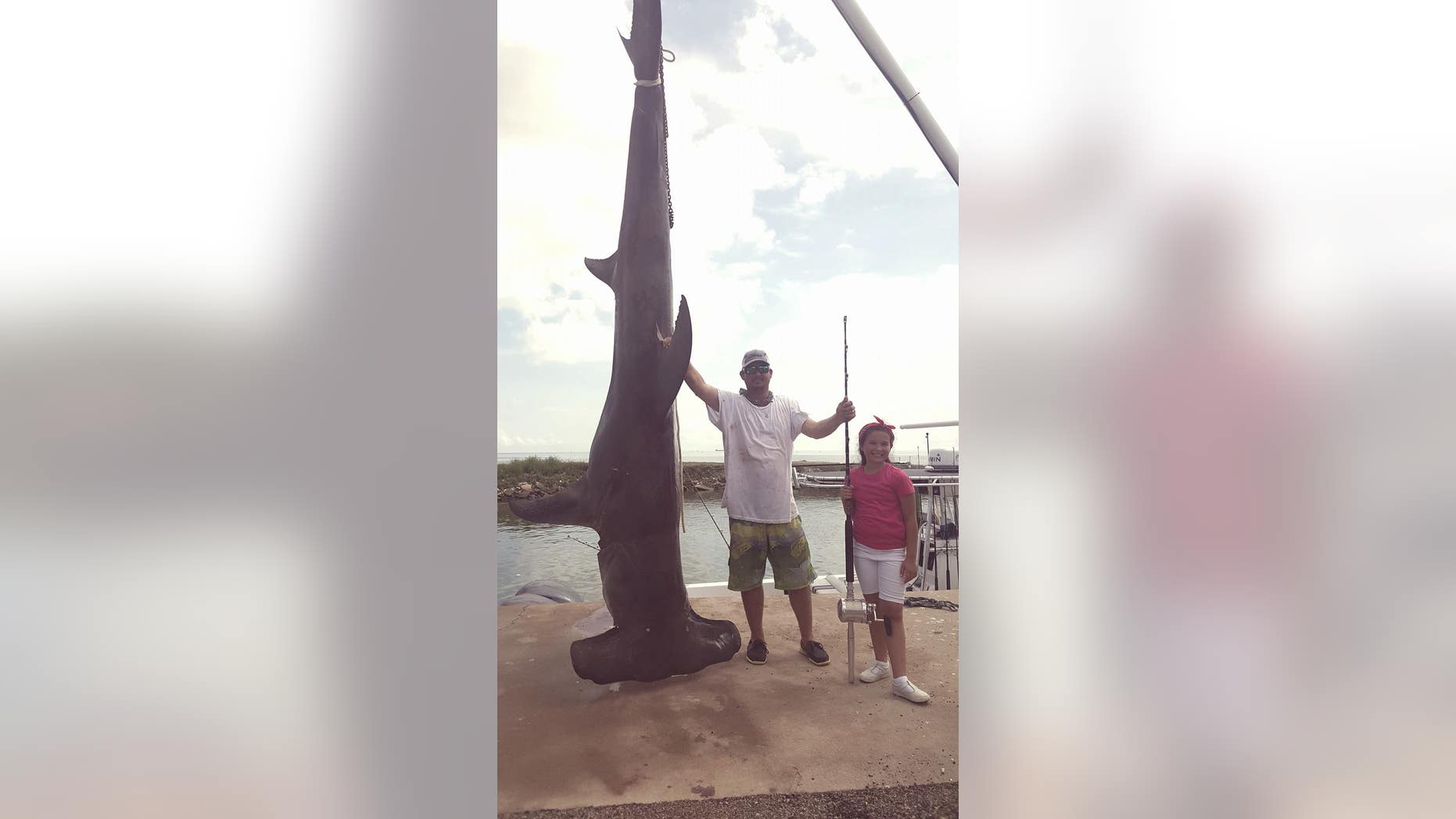 Tim McClellen brought in the massive, record-breaking hammerhead shark at the Texas City Jaycees fishing tournament Sunday.