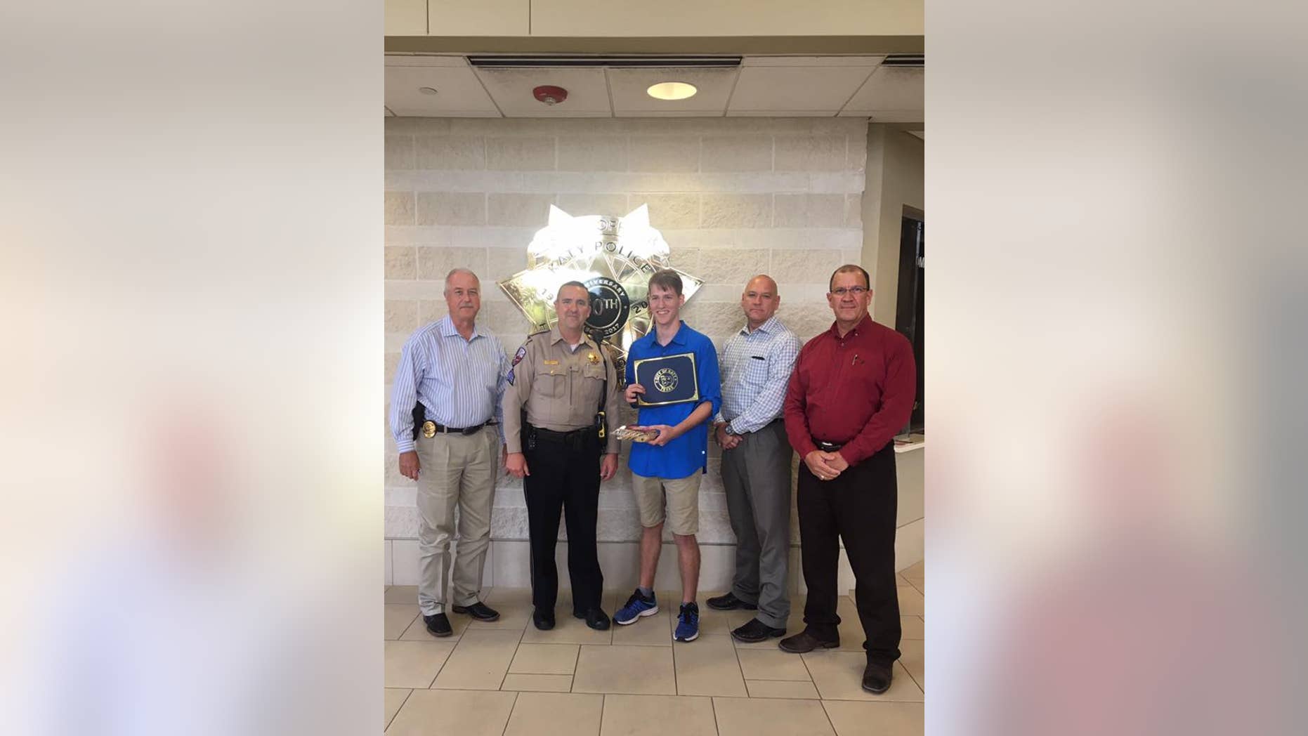 The Katy Police Department in Texas honored Zachary Randolph for purchasing an officer an item from a cookie store. (Katy Police Department)
