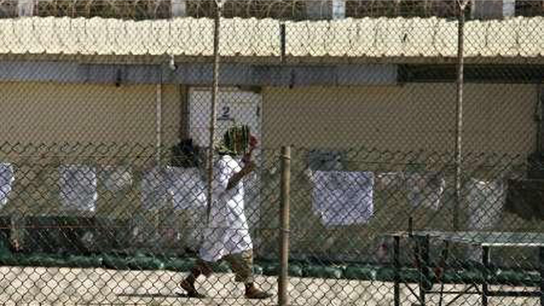 A detainee walks inside a yard at the detention facility at Guantanamo Bay May 31, 2010.