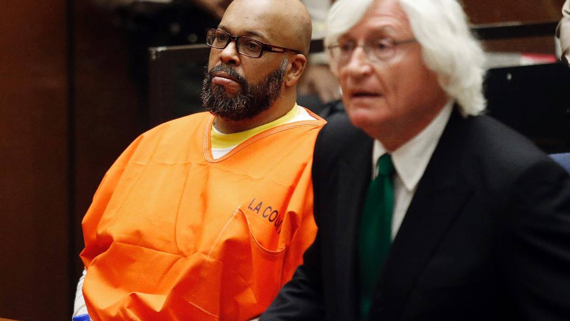 FILE - In this Tuesday, July 7, 2015 photo, Marion Hugh "Suge" Knight, left, sits with his attorney Thomas Mesereau, in Los Angeles Superior Court, during a hearing in a murder case filed against the Death Row Records co-founder. The former rap music mogul Knight returns to court on Friday, July 17, to ask that a judge reduce his bail on murder and attempted murder charges from $10 million. (Patrick T. Fallon/Pool Photo via AP, File)