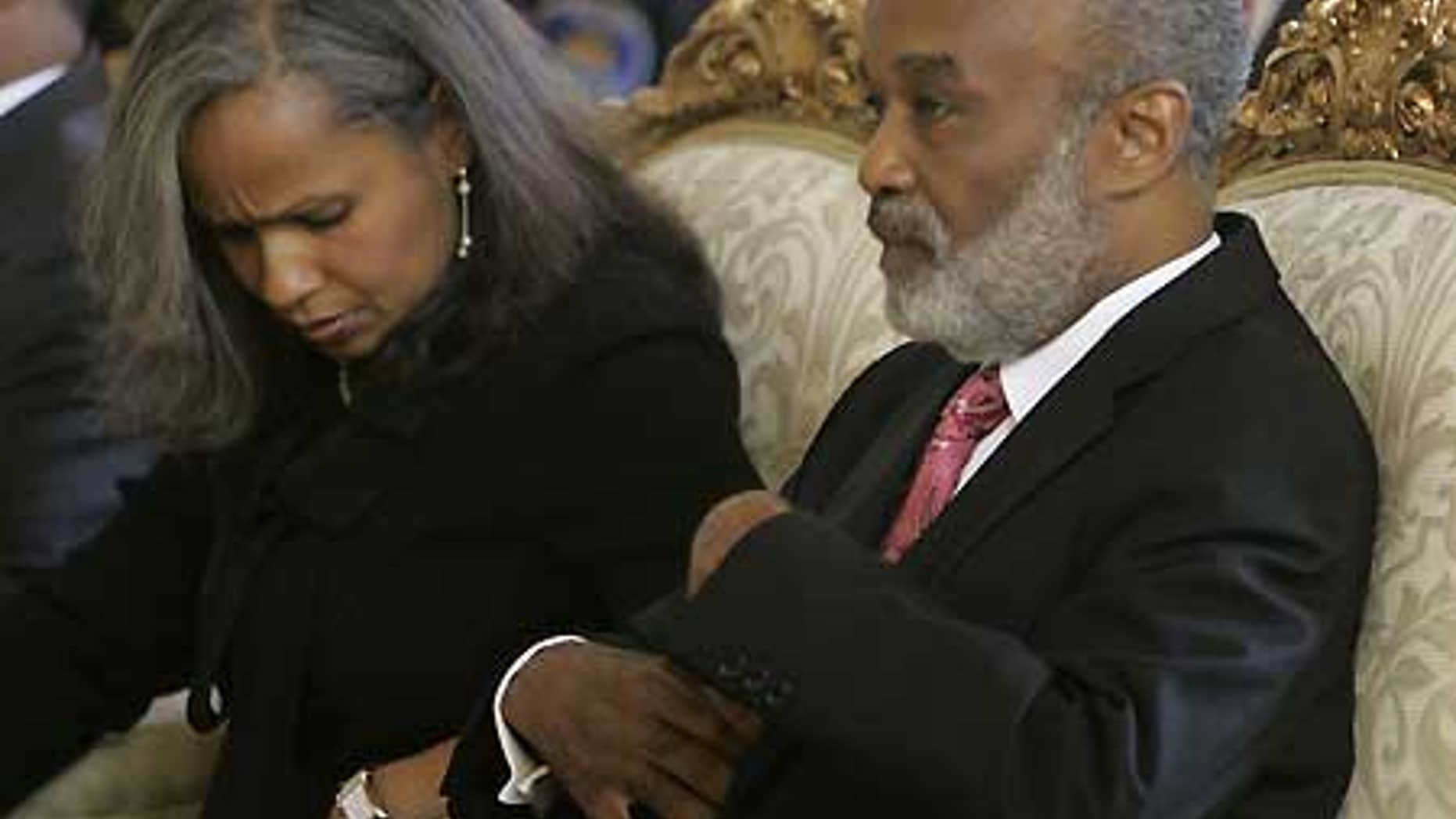 Jan. 1: Haiti's President Rene Preval sits with his wife, fist lady Elisabeth Debrosse Delatour.