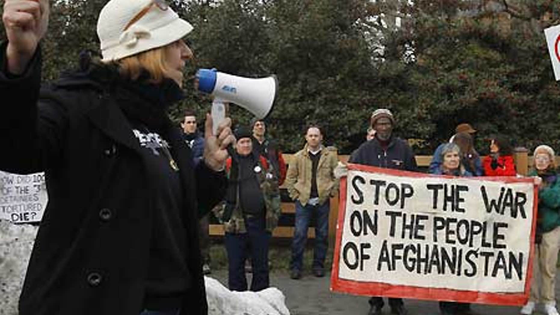 Jan. 16: Activist Cindy Sheehan points down the road toward former Vice President Dick Cheney's house during an anti-war protest in Langley, Va.