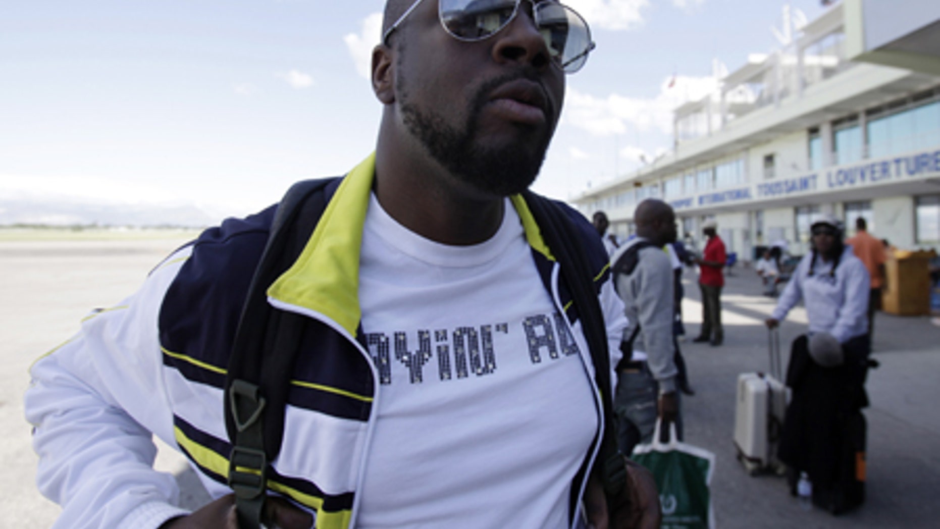 Jan. 13: Musician Wyclef Jean, a native of Haiti, arrives at the airport in Port-au-Prince in the aftermath of a devastating earthquake.