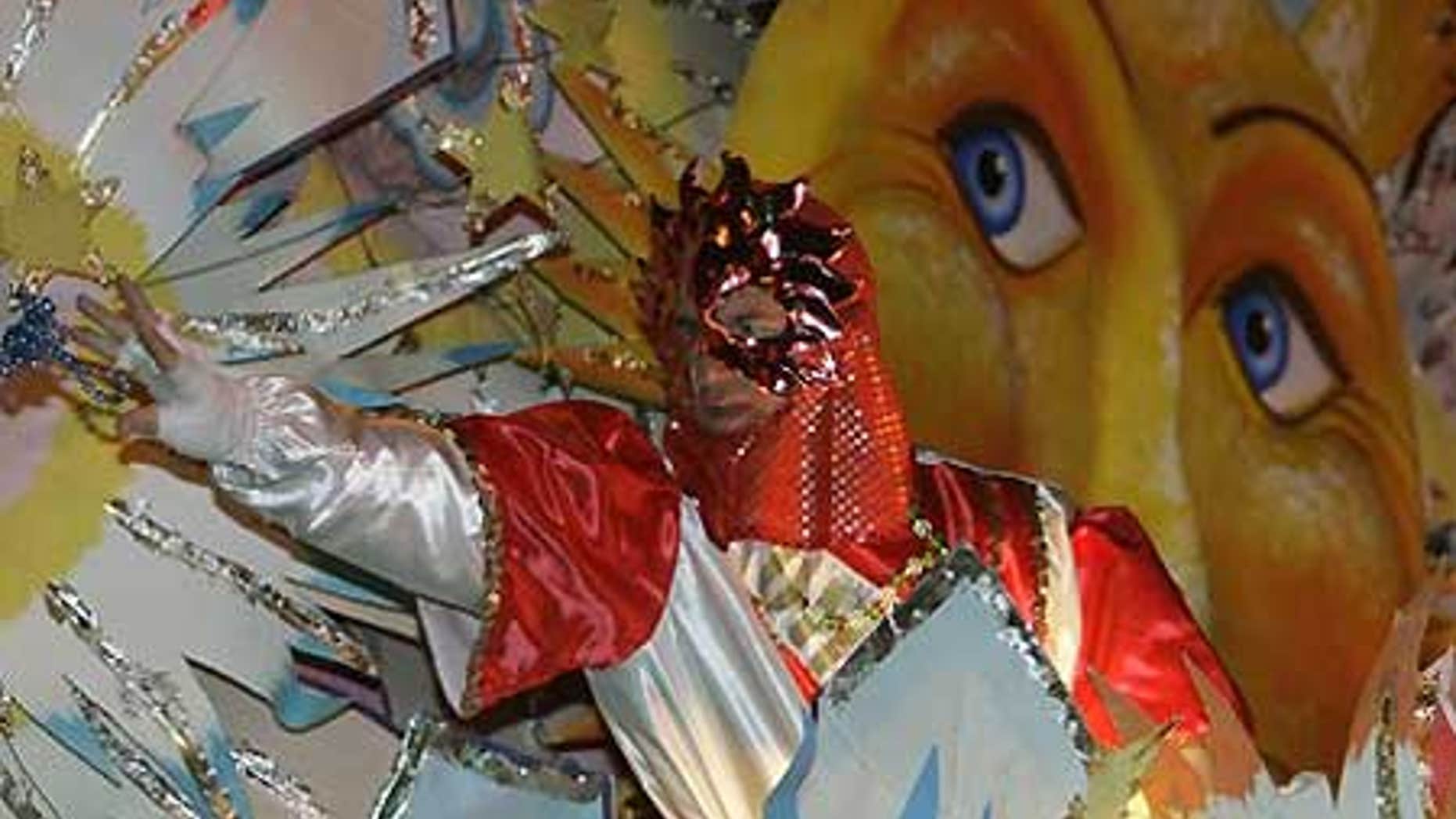 Feb. 23: A rider on a float throws beads during the Krewe of Orpheus parade in the Uptown area of New Orleans as Mardi Gras enters its final hours.