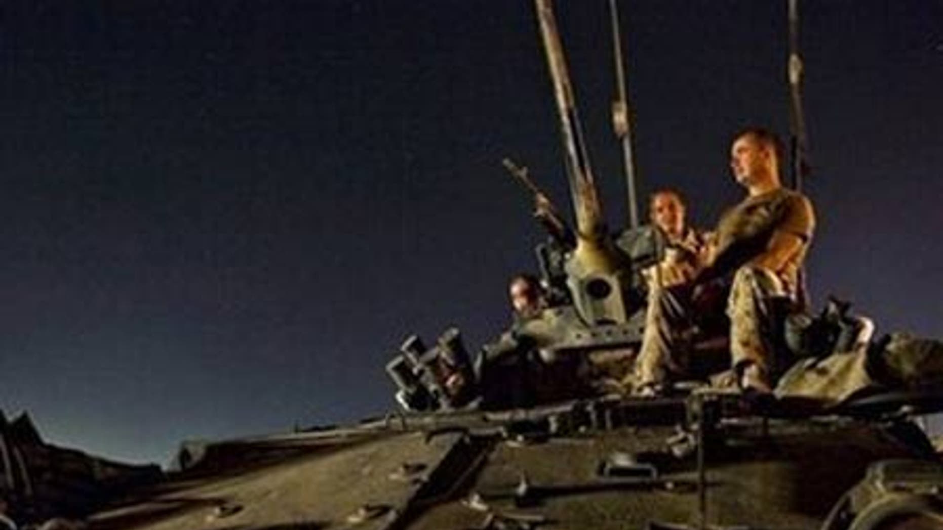 ISAF soldiers are seen on an armored vehicle during a recent mission in southern Afghanistan.