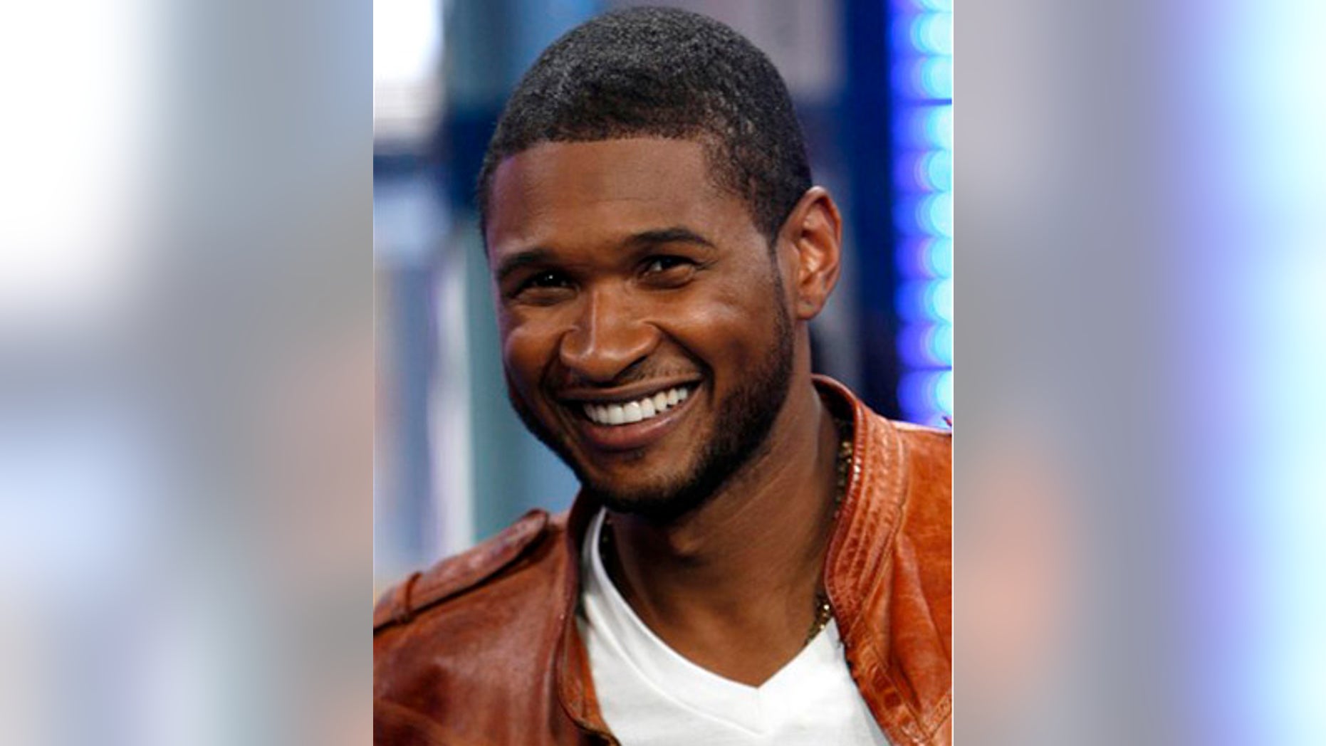 ** FILE ** In this May 27, 2008 file photo, Usher is shown on MTV's Total Request Live in New York. (AP Photo/Jason DeCrow, file)
