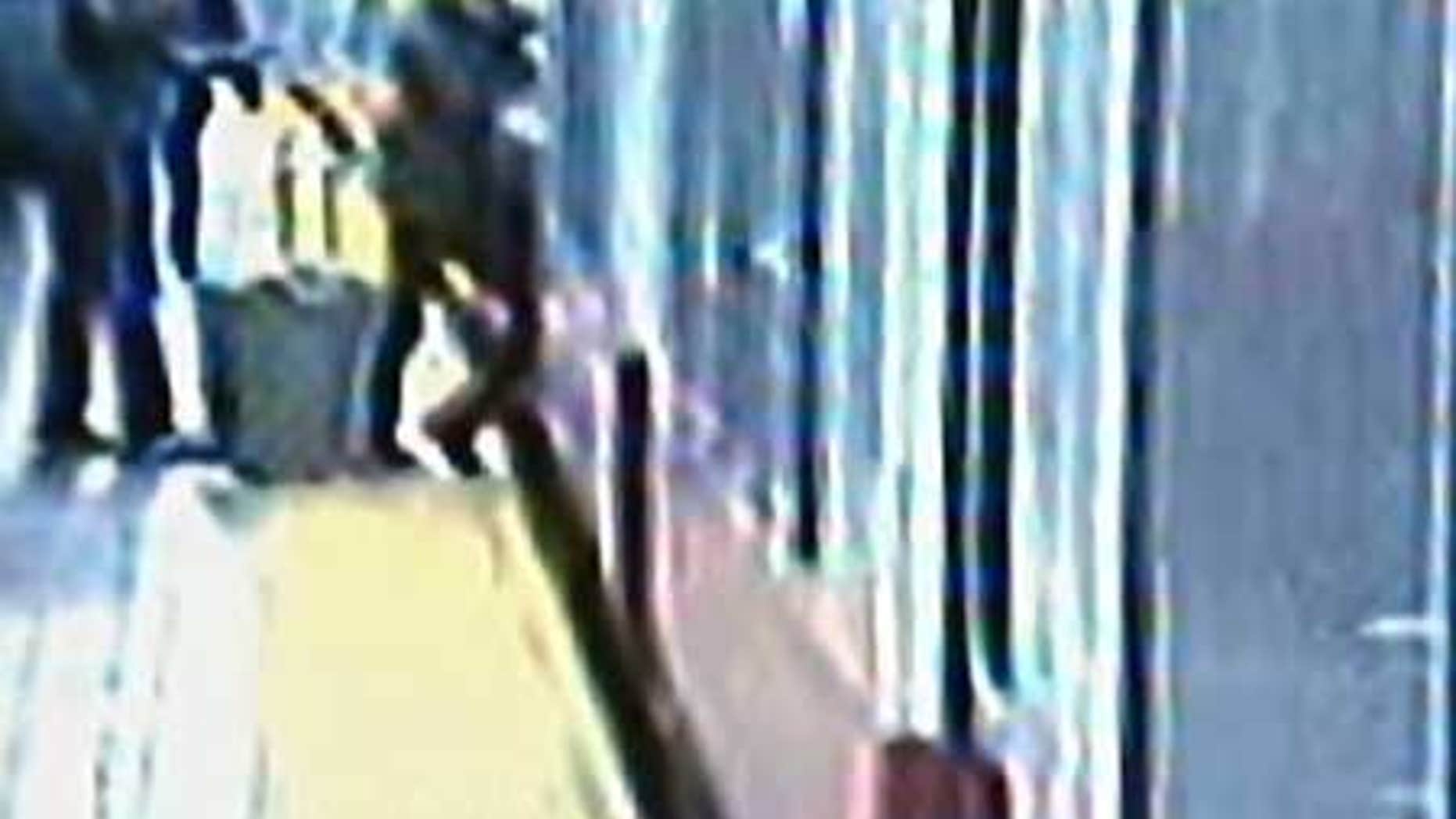 Woman's bag gets stuck trying to get on an MBTA train in Boston.