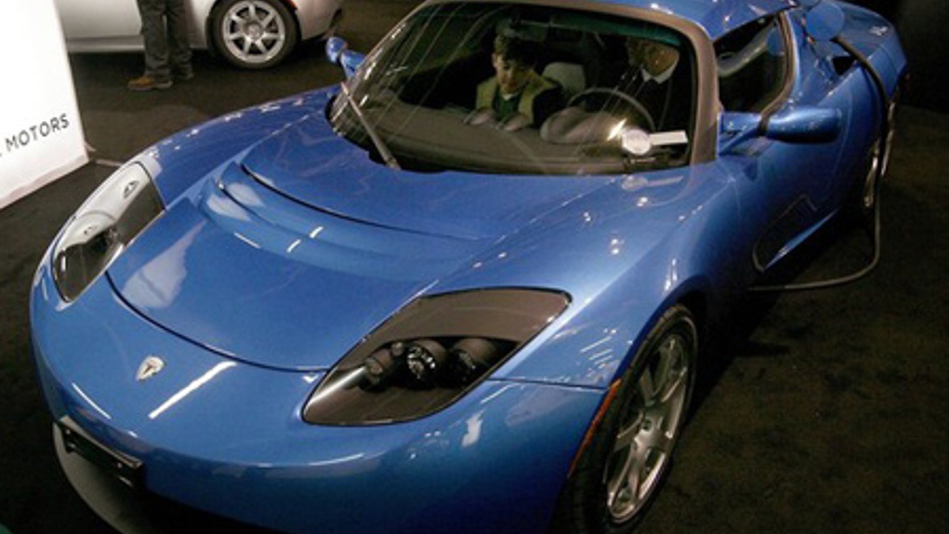 March 4: A battery-powered Tesla Roadster car is displayed.