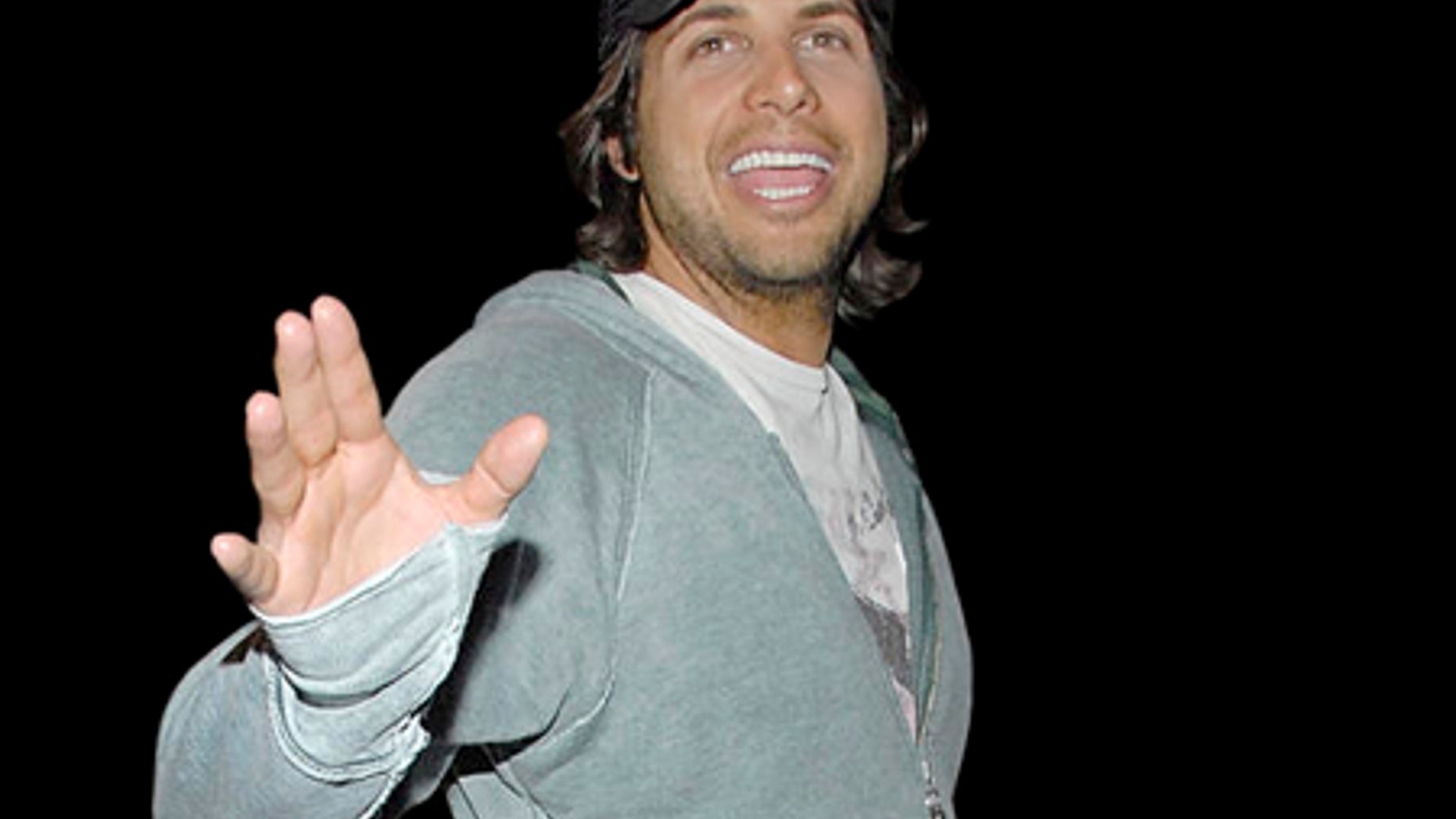 ** FILE ** Producer of "Girls Gone Wild" Joe Francis waves to fans and the press at the Los Angeles International Airport in Los Angeles in this March 12, 2008, file photo. (AP Photo/Dan Steinberg, file)