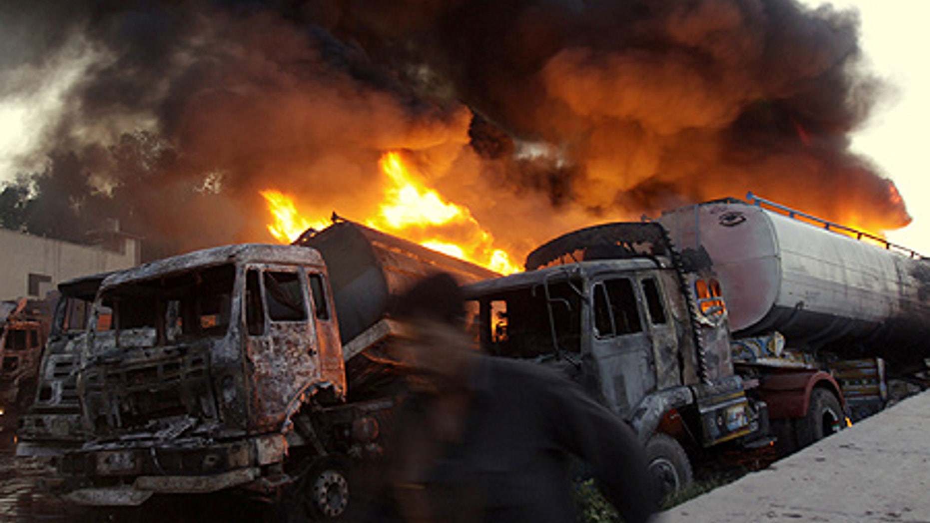 Apr. 23: Dozens of militants armed with guns and gasoline bombs attack NATO's truck terminal in Peshawar, Pakistan.