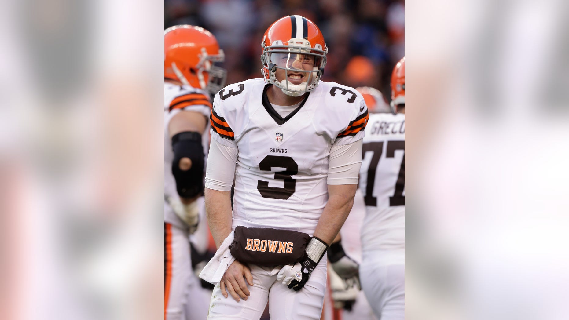 Cleveland Browns quarterback Brandon Weeden (3) reacts after being injured on a sack by the Denver Broncos in the third quarter of an NFL football game, Sunday, Dec. 23, 2012, in Denver. (AP Photo/Joe Mahoney)