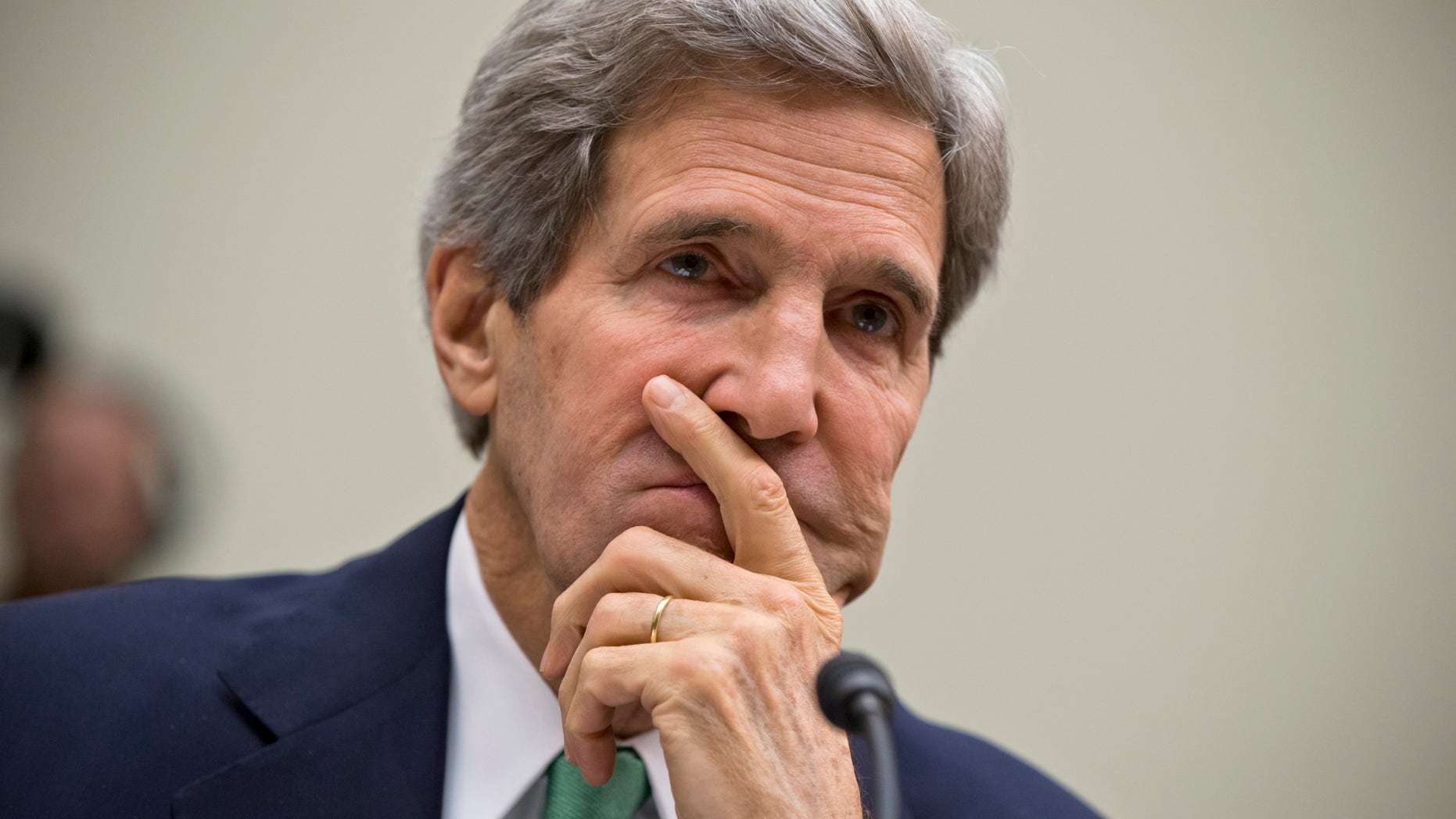 In this Dec. 10, 2013, photo, Secretary of State John Kerry testifies on Capitol Hill in Washington, before the House Foreign Affairs Committee. Continuing a furious pace of shuttle diplomacy aimed at securing an elusive Israeli-Palestinian peace deal by the spring, Kerry arrives in the Middle East on Dec. 12 on his ninth trip of the year. In closed door talks with Israeli Prime Minister Benjamin Netanyahu and Palestinian President Mahmoud Abbas on Thursday and Friday, Kerry will be following up on elements of a West Bank security plan, ideas for which he unveiled on his most recent visit to the region just last week, and other points of potential progress. (AP Photo/J. Scott Applewhite)