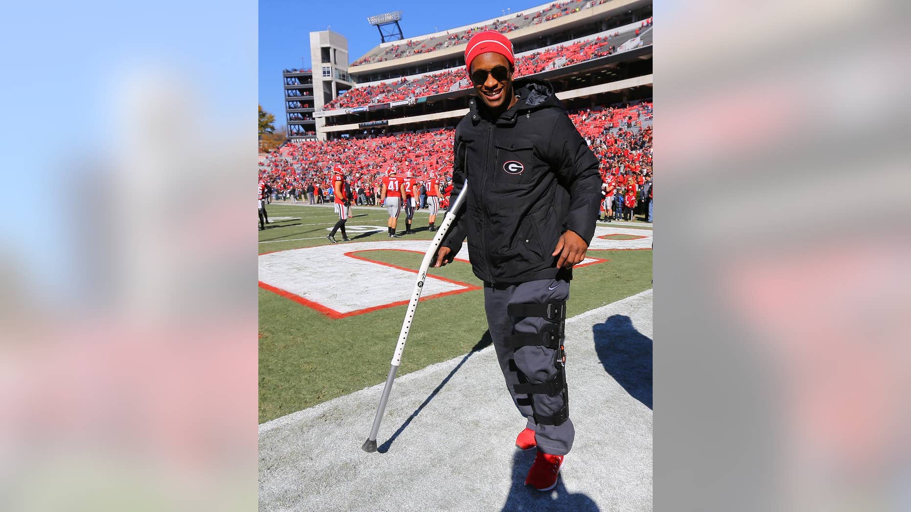 Injured Georgia running back Todd Gurley, who is expected to miss the remainder of the season after injuring his knee last week against Auburn, walks the end zone on a crutch and a leg brace while his team prepares to play Charleston Southern in an NCAA college football game, Saturday, Nov. 22, 2014, in Athens, Ga. (AP Photo/Atlanta Journal-Constitution, Curtis Compton) MARIETTA DAILY OUT; GWINNETT DAILY POST OUT; LOCAL TELEVISION OUT; WXIA-TV OUT; WGCL-TV OUT