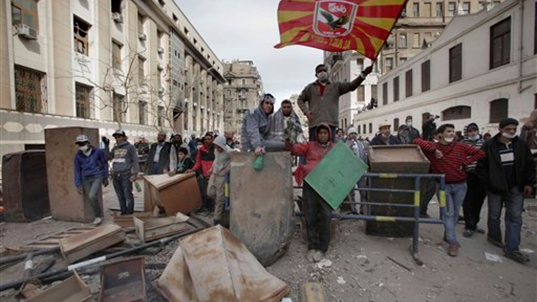 Feb. 3: Egyptian protestors block the road during clashes with security forces near the Interior Ministry in Cairo, Egypt. A volunteer doctor says police and protesters angry over a deadly soccer riot have clashed for the second day in the Egyptian capital.