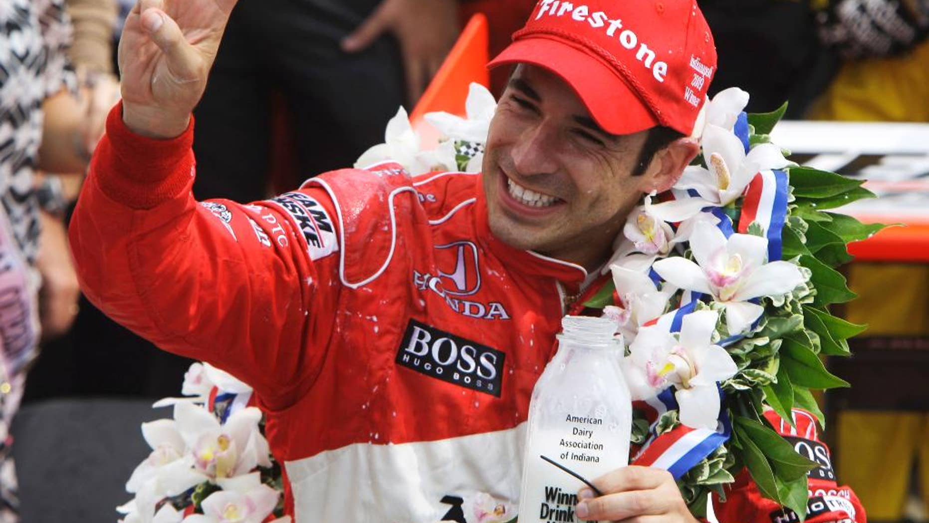 FILE - In this May 24, 2009 file photo, Helio Castroneves, of Brazil, holds up three fingers after winning his third Indianapolis 500 auto race, at Indianapolis Motor Speedway in Indianapolis, Ind. (AP Photo/Darron Cummings, File)