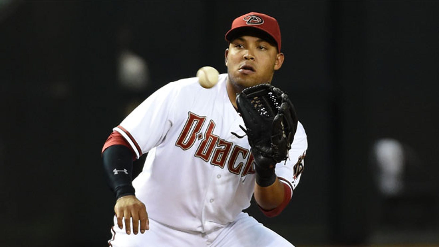 PHOENIX, AZ - APRIL 24: Yasmany Tomas #24 of the Arizona Diamondbacks catches a throw from the catcher after a strike out in the fourth inning against the Pittsburgh Pirates at Chase Field on April 24, 2015 in Phoenix, Arizona. (Photo by Norm Hall/Getty Images)