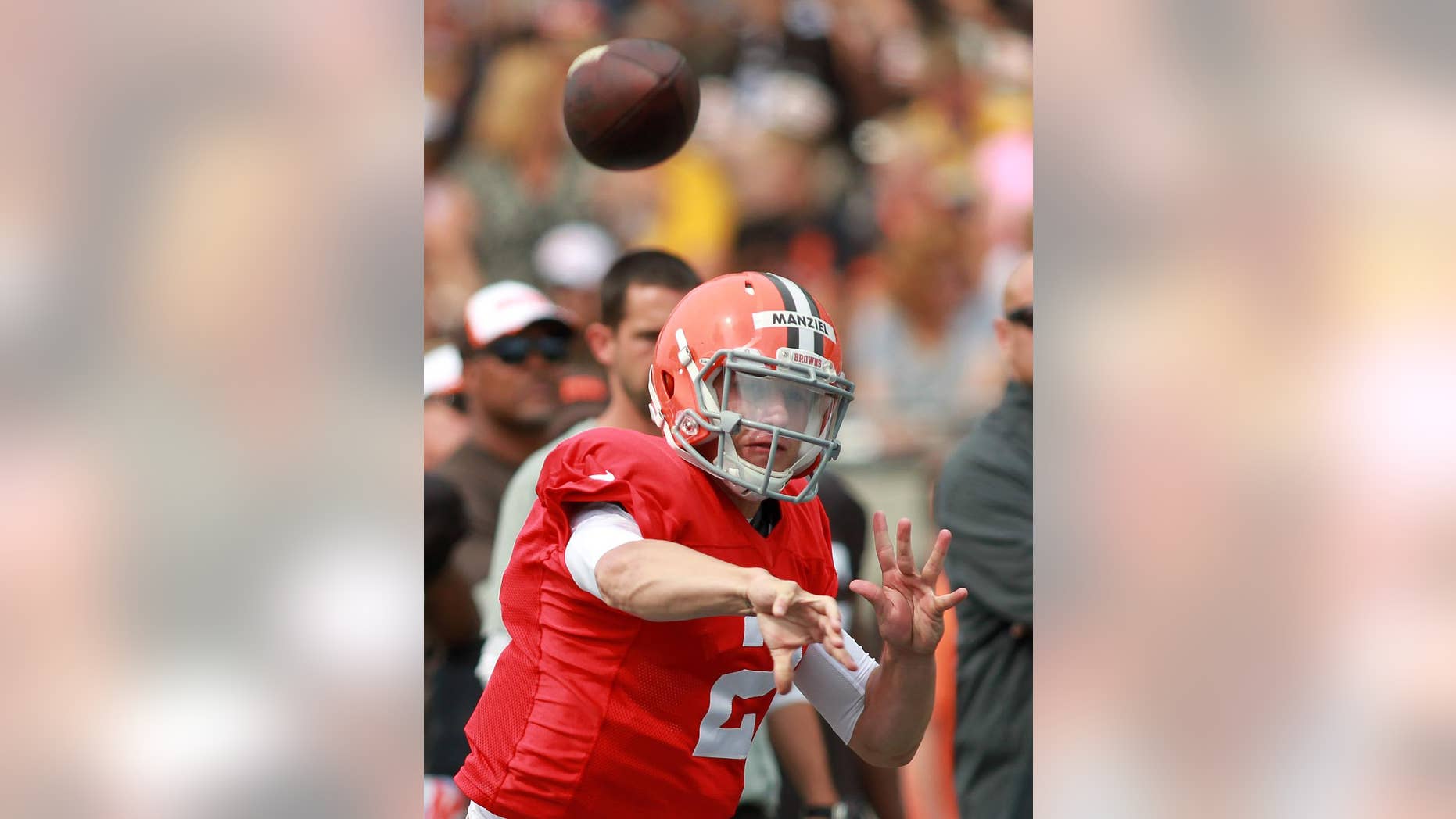 Cleveland Browns quarterback Johnny Manziel throws a pass at the NFL football team's training camp that was held at InfoCision Stadium in Akron, Ohio, Saturday, Aug. 2, 2014. (AP Photo/Aaron Josefczyk)