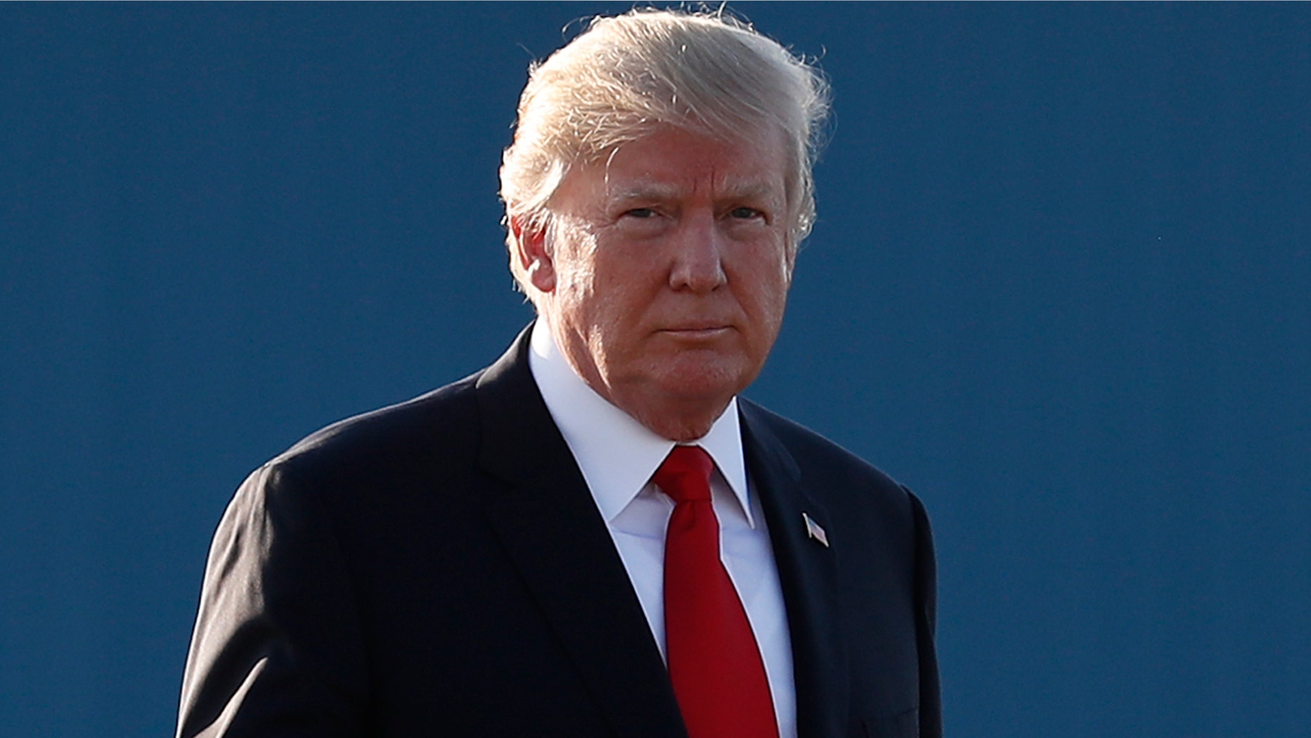 President Trump walks to board Air Force One in Morristown, N.J. Sunday evening.