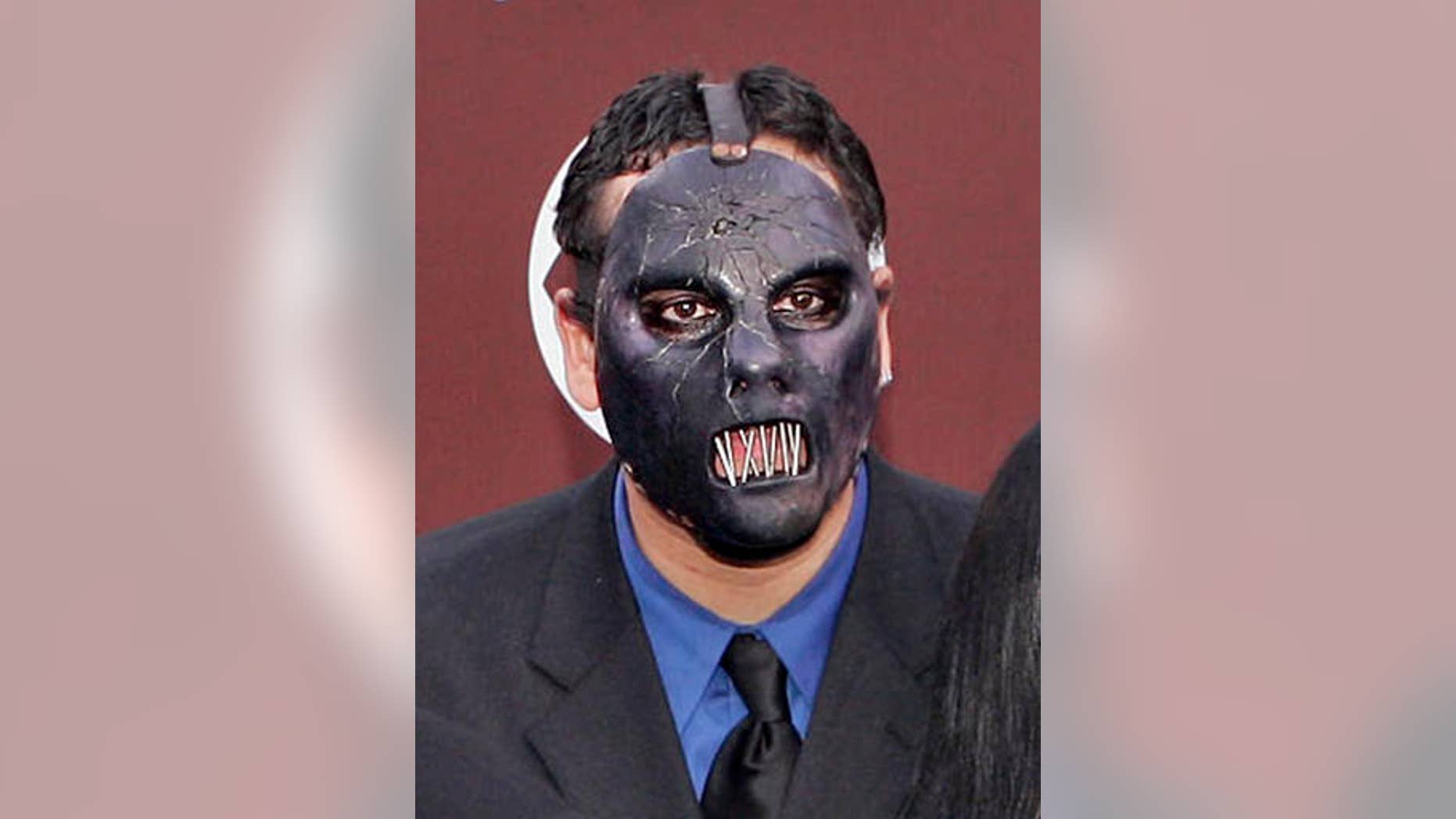FILE - In this Feb. 13, 2005 file photo, Paul Gray from the group Slipknot arrives for the 47th Annual Grammy Awards in Los Angeles. The Iowa Supreme Court says the deceased Slipknot bassist's daughter may sue for loss of a parent's companionship, even though she was born after her father died. The ruling Friday May 6, 2016, comes in the wrongful death lawsuit that Gray's widow filed after the heavy metal bassist died of a drug overdose in May 2010. (AP Photo/Mark J. Terrill, File)