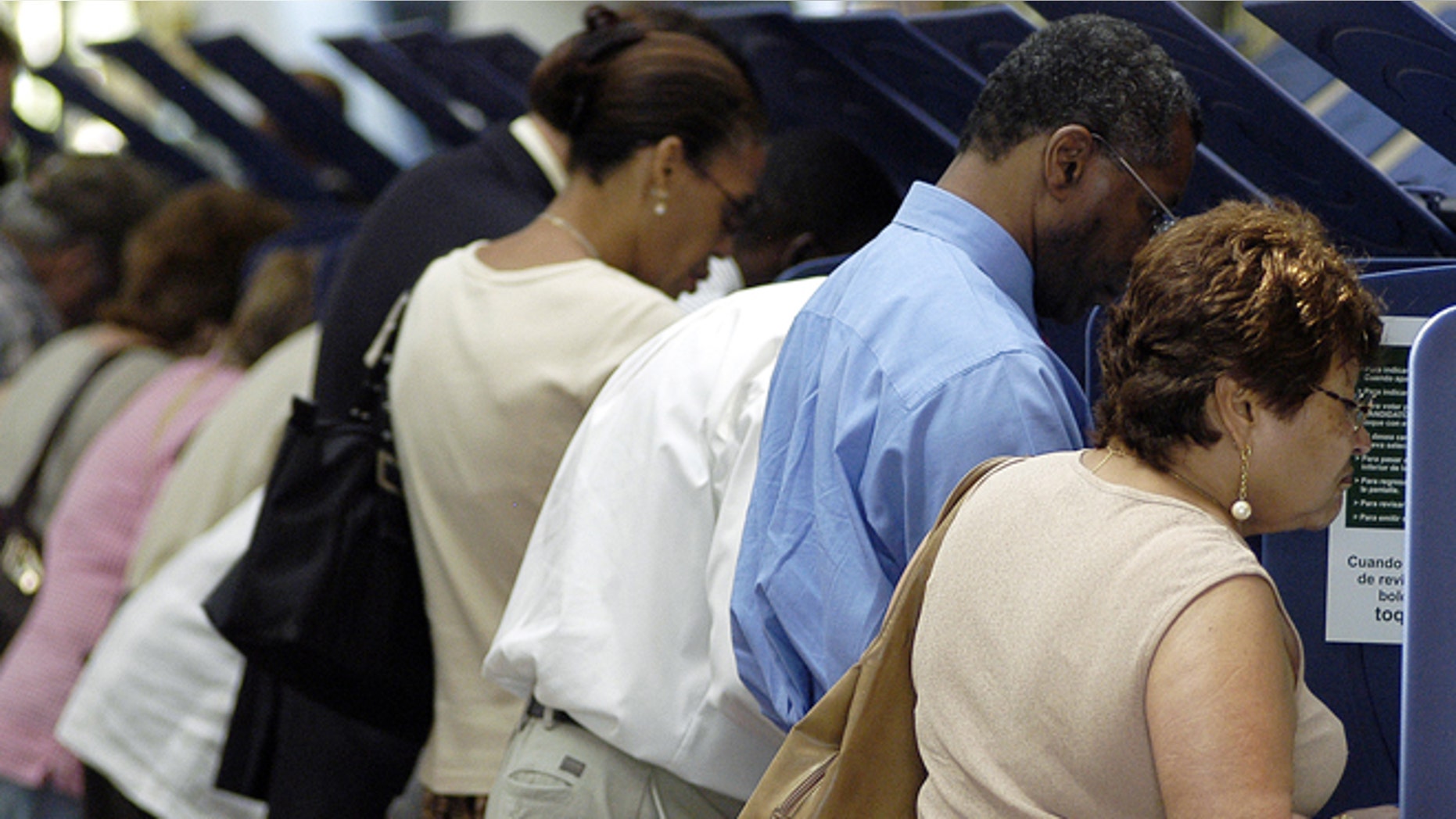 MIAMI - OCTOBER 21: Hispanic voters go to the polls for early voting at the Miami-Dade Government Center on October 21, 2004 in Miami, Florida. Early voting began this week in Florida and is under heavy scrutiny after the debacle in the 2000 election. (Photo by G. De Cardenas/Getty Images)