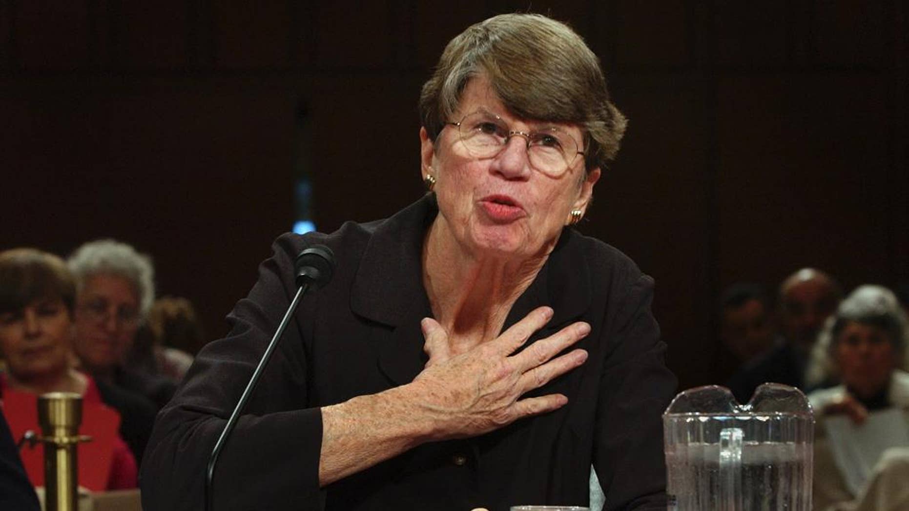 FILE- In this Tuesday, April 13, 2004, file photo, former U.S. Attorney General Janet Reno testifies before the commission investigating the Sept. 11 attacks on Capitol Hill in Washington. The South Florida home where Reno lived will be preserved and donated to Miami-Dade College. It's slated to become part of the environmental center at the college's campus south of Miami. (AP Photo/Dennis Cook, File)