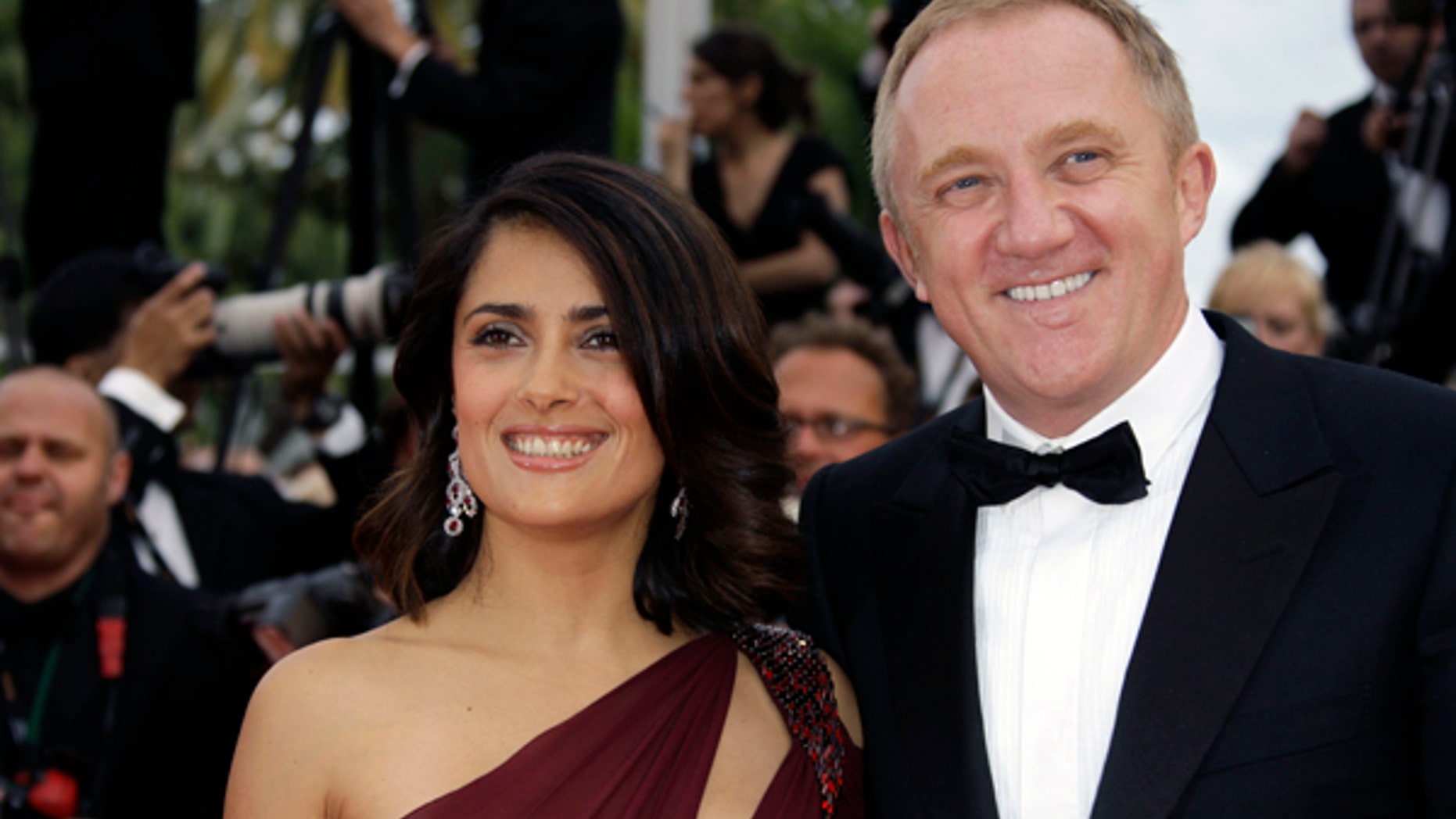 Actress Salma Hayek and husband François-Henri Pinault arrive at the premiere for the film "Robin Hood", at the 63rd international film festival, in Cannes, southern France, Wednesday, May 12, 2010. (AP Photo/Joel Ryan)