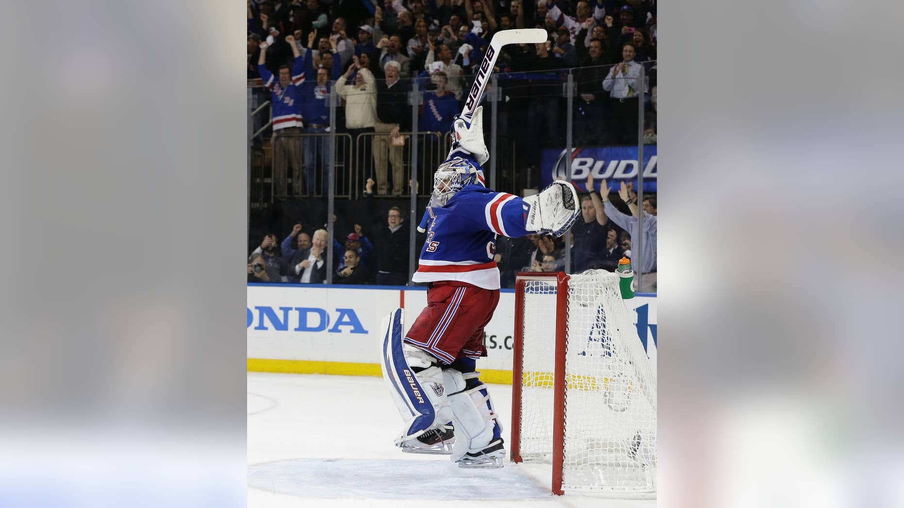 New York Rangers goalie Henrik Lundqvist (30) reacts as time winds off the clock to give the New York Rangers a 1-0 win over the Montreal Canadiens in Game 6 of the NHL hockey Stanley Cup playoffs Eastern Conference finals, Thursday, May 29, 2014, in New York. The Rangers advance to the Stanley Cup Finals. (AP Photo/Julie Jacobson)