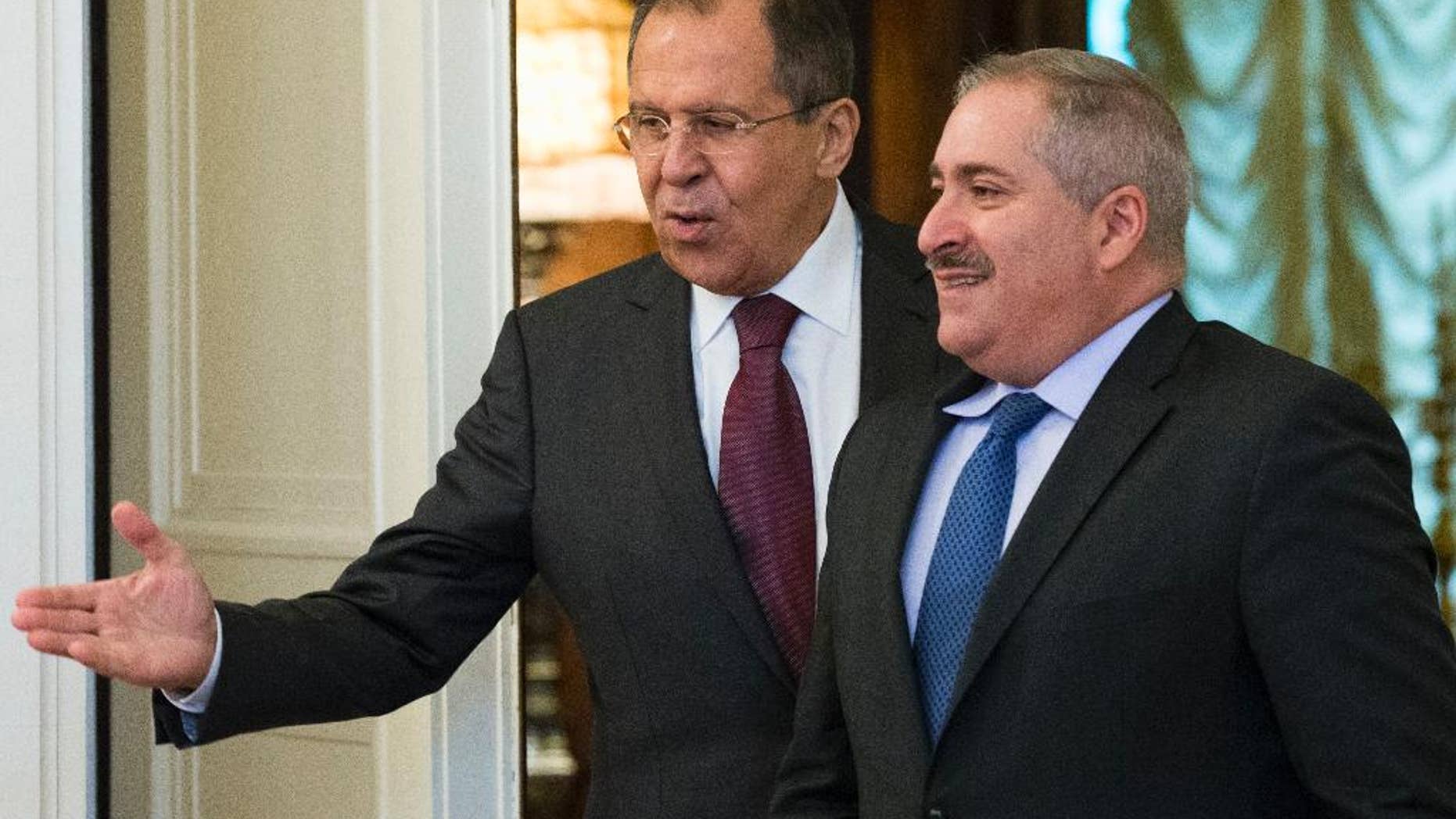 Russian Foreign Minister Sergey Lavrov, left, welcomes Jordanian Foreign Minister Nasser Judeh before their talks in Moscow, Russia, Thursday, June 9, 2016. The talks focused on bilateral ties and the situation in Syria. (AP Photo/Alexander Zemlianichenko)