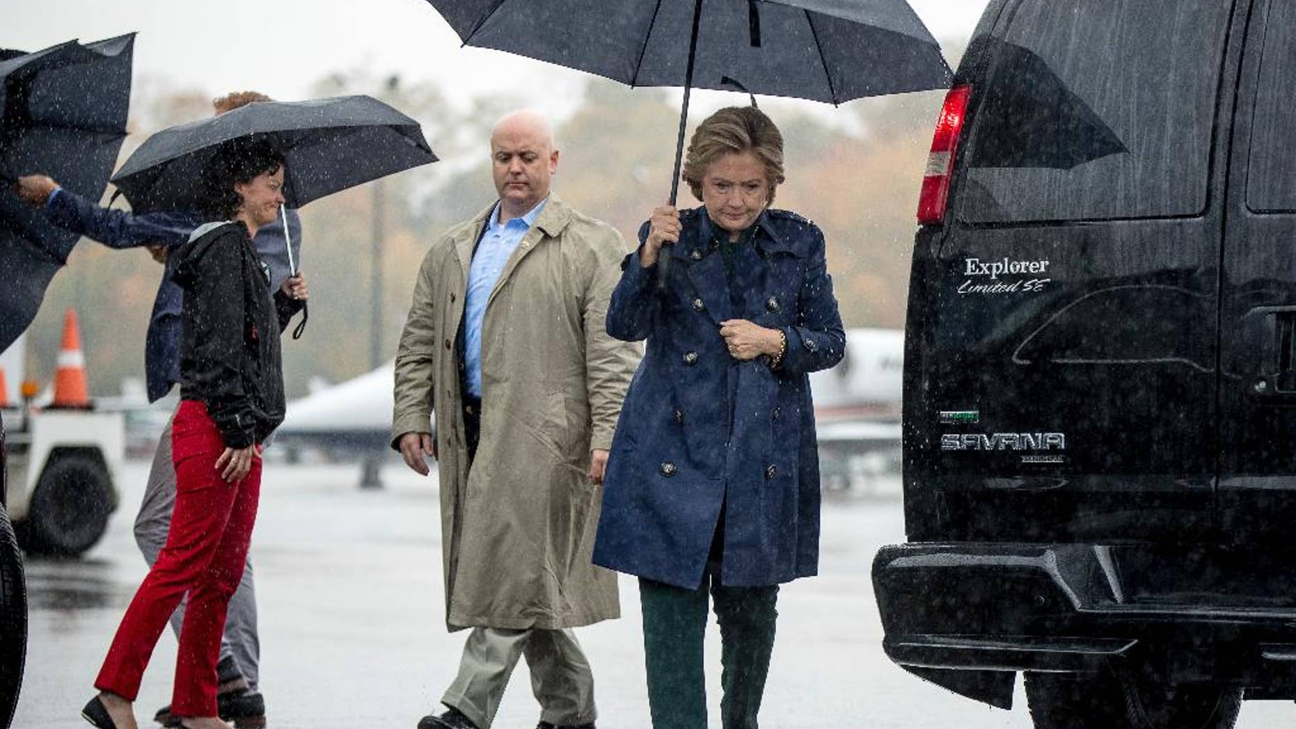 Democratic presidential candidate Hillary Clinton arrives to board her campaign plane at Westchester County Airport in White Plains, N.Y., Friday, Oct. 21, 2016, to travel to Cleveland for a rally. (AP Photo/Andrew Harnik)