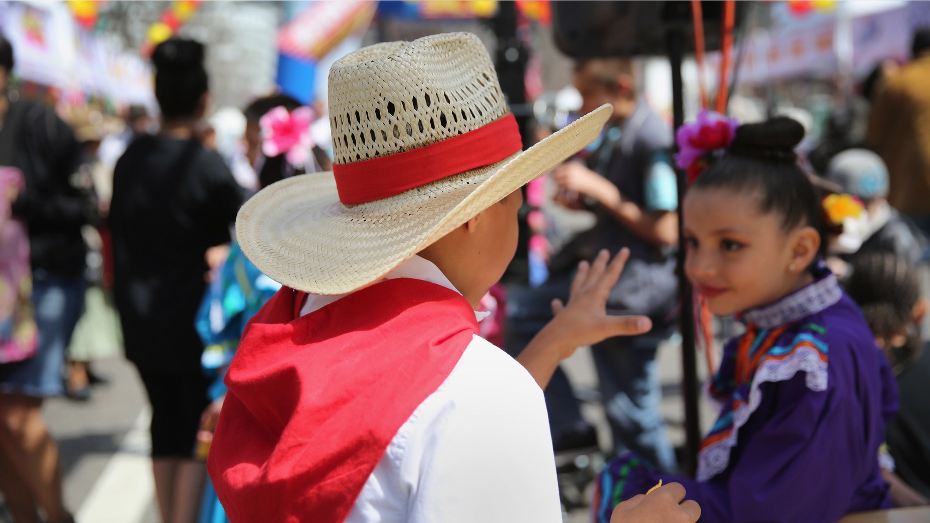 DENVER, CO - MAY 04: Children dressed in traditional Mexican attire attend a Cinco de Mayo festival on May 4, 2013 in Denver, Colorado. Hundreds of thousands of people were expected to attend the two day event, billed as the largest Cinco de Mayo celebration in the United States. Cinco de Mayo observes the victory of the Mexican army over French forces on May 5, 1862 in the town of Puebla, Mexico. The festival celebrates Mexican culture and is one of the most popular annual Latino events in the United States. (Photo by John Moore/Getty Images)