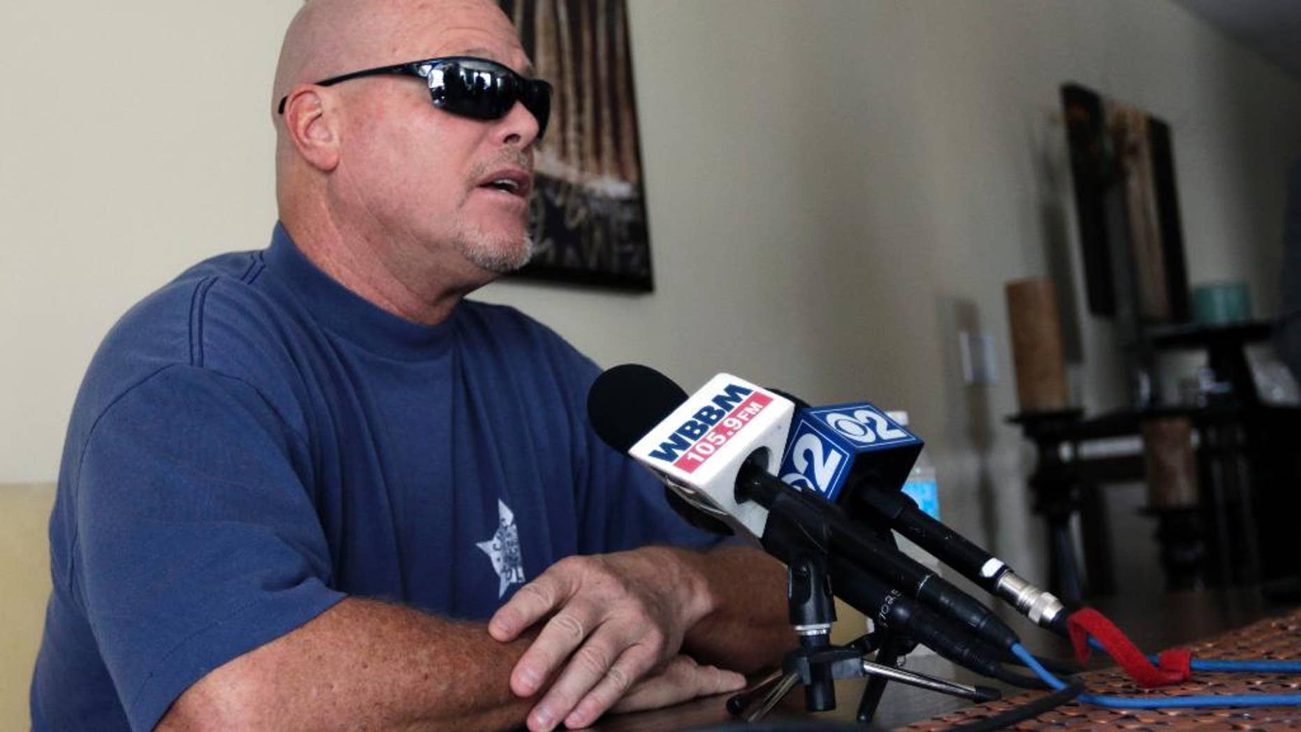 Former NFL football quarterback Jim McMahon speaks during a news conference Tuesday, June 17, 2014 in Chicago. McMahon spoke of his ongoing battle with dementia that he believe is related to his years of hits he took while playing in the league. McMahon is part of a federal lawsuit filed in San Francisco accusing teams of illegally dispensing powerful narcotics and other drugs to keep players on the field without regard for their long-term health. He led the Chicago Bears to victory in the 1985 Super Bowl. (AP Photo/Stacy Thacker)