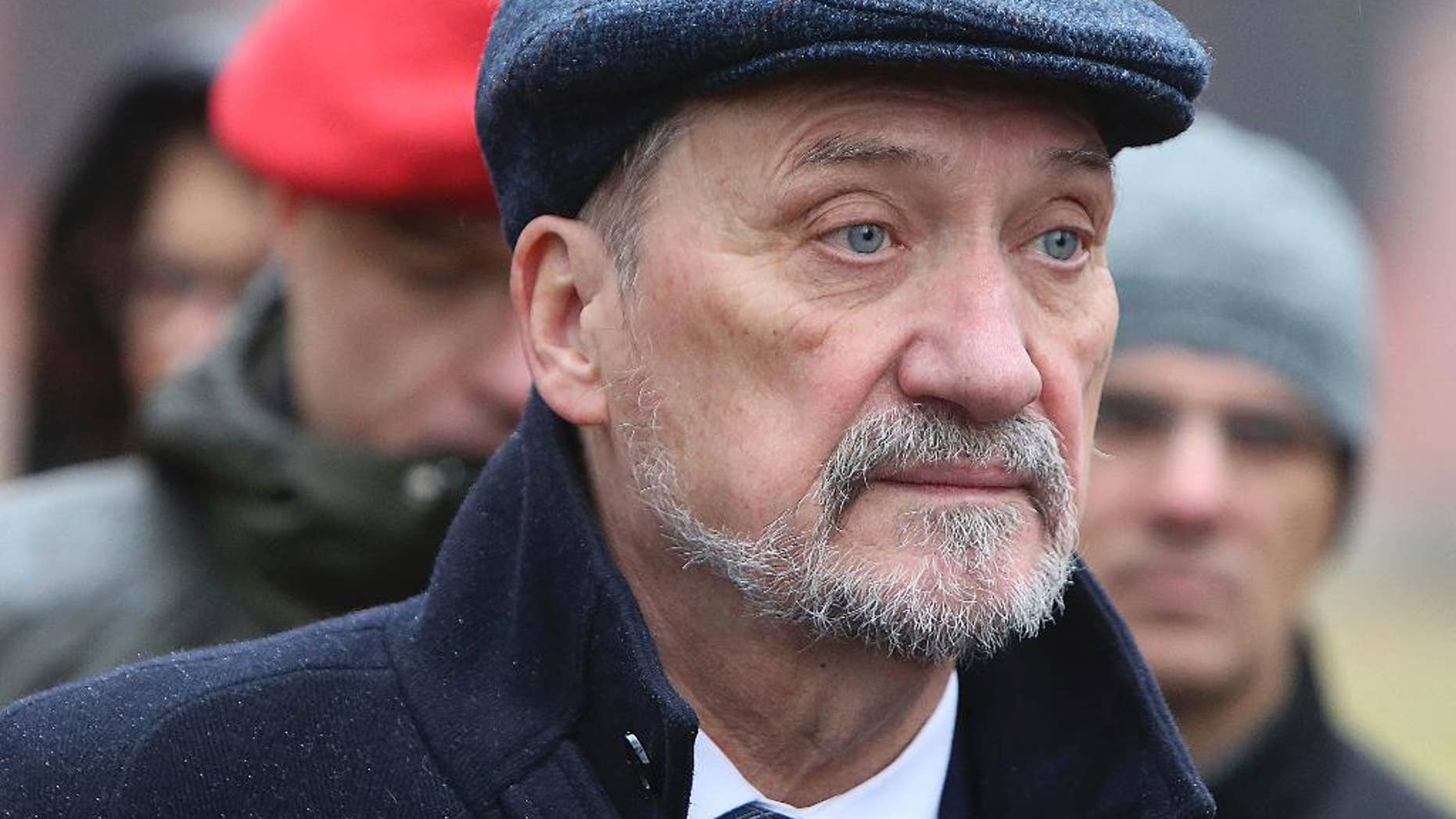 In this photo taken Nov. 6, 2016, Polish Defense Minister Antoni Macierewicz watches military training in Minsk Mazowiecki, Poland. Macierewicz was involved in a multi-car accident on Wednesday, Jan. 25, 2017 but was not hurt. (AP Photo/Czarek Sokolowski)