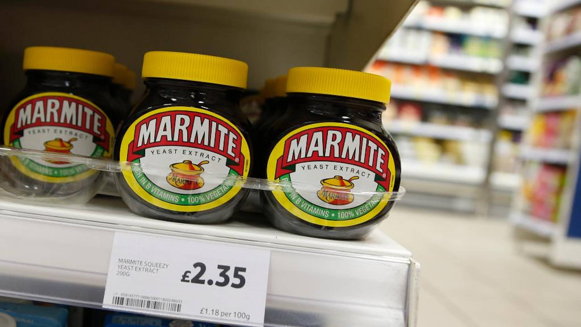 FILE - This is a Thursday, Oct. 13,2016 file photo of jars of savoury spread 'Marmite' which is owned by the Anglo-Dutch multinational Unilever, on sale in a supermarket in central London. Consumer products giant Unilever said Thursday April 6, 2017 that it plans to sell its spreads division and combine its foods and refreshments units as part of a major review of operations prompted by a $143 billion takeover bid by rival Kraft Heinz that fell through in February. (AP Photo/Alastair Grant)