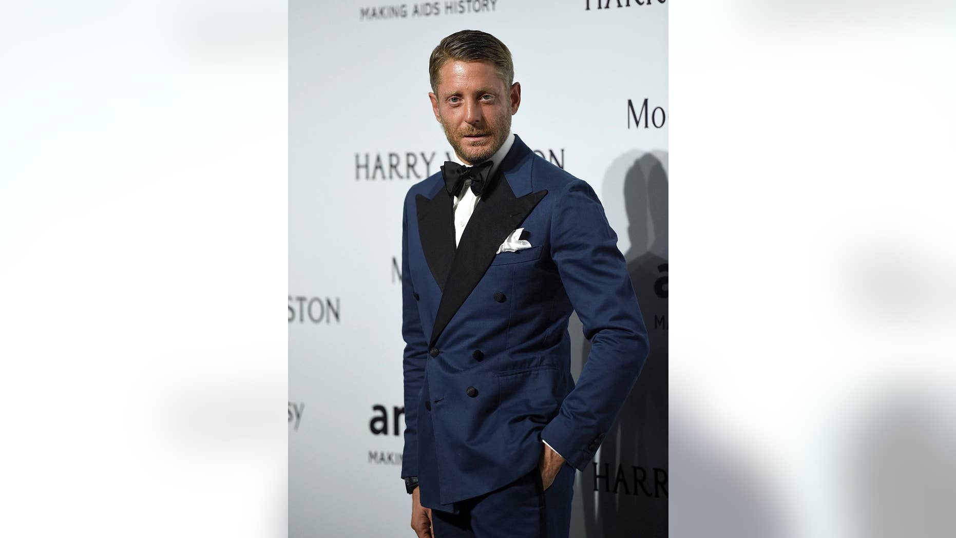 FILE - In this Sept. 26, 2015 file photo, Lapo Elkann arrives for an amfAR charity dinner in Milan, Italy. A criminal charge by the Manhattan district attorney has been dropped against the playboy grandson of the Italian founder of Fiat Automobiles who had been accused of filing a false report when he claimed he was being held against his will in New York City. The 39-year-old was arrested outside a public housing project in December 2016 after his family contacted police, saying he needed $10,000 to guarantee his safety. But authorities say he made up the story after he ran out of money following a two-day binge with an escort. (AP Photo/Giuseppe Aresu, File)