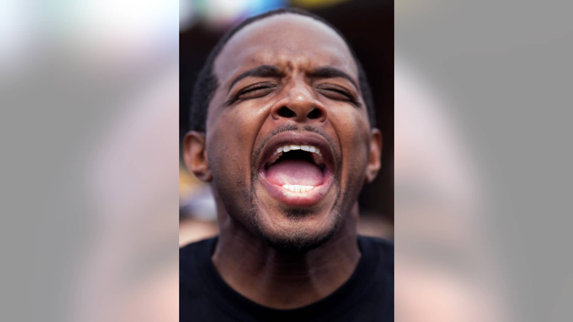 Jay Morrison gives a speech in front of the Triple S convenience store in Baton Rouge, Saturday, July 9, 2016. Protest were planned all over Baton Rouge by groups demanding justice for Alton Sterling, a black man killed by white police officers on Tuesday. (AP Photo/Max Becherer)
