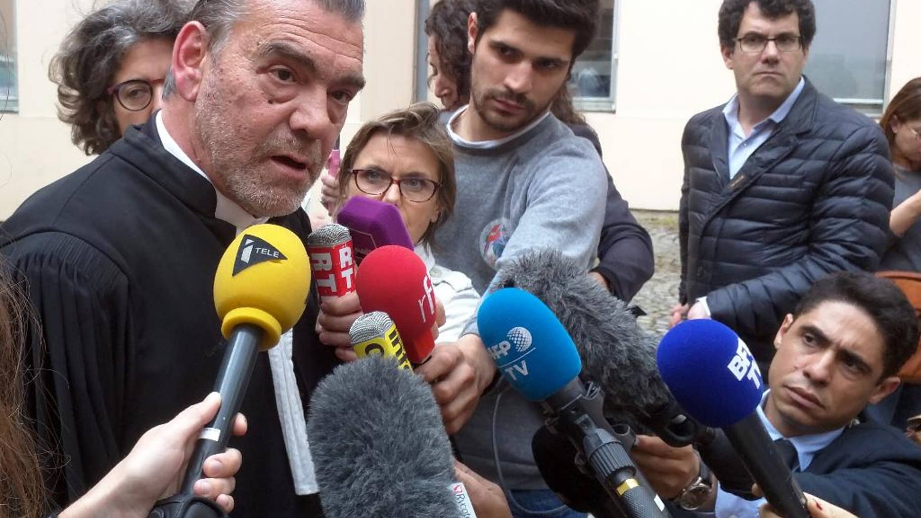 Lawyer Frank Berton, left, who represents Paris attacks suspect Salah Abdeslam, speaks to journalists outside an administrative tribunal in the Parisian suburb of Versailles, France, Wednesday, July 13, 2016. Berton is appealing to the tribunal to have two live video cameras removed from Abdeslam’s cell in the French prison of Fleury-Merogis, saying they risk damaging him psychologically. (AP Photo/Raphael Satter)