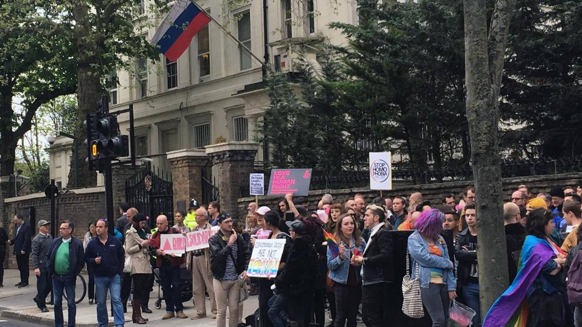 People protest outside the Russian Embassy in London, following reports of the torture and murder of gay men in Chechnya, Wednesday April 12, 2017. The United Nations’ High Commissioner for Human Rights called upon the Russian government in a statement “to put an end to the persecution of people perceived to be gay or bisexual, while Chechen authorities denied the reports, and spokesman for leader Ramzan Kadyrov insisted there were no gay people in Chechnya. (Thomas Hornall/PA via AP)