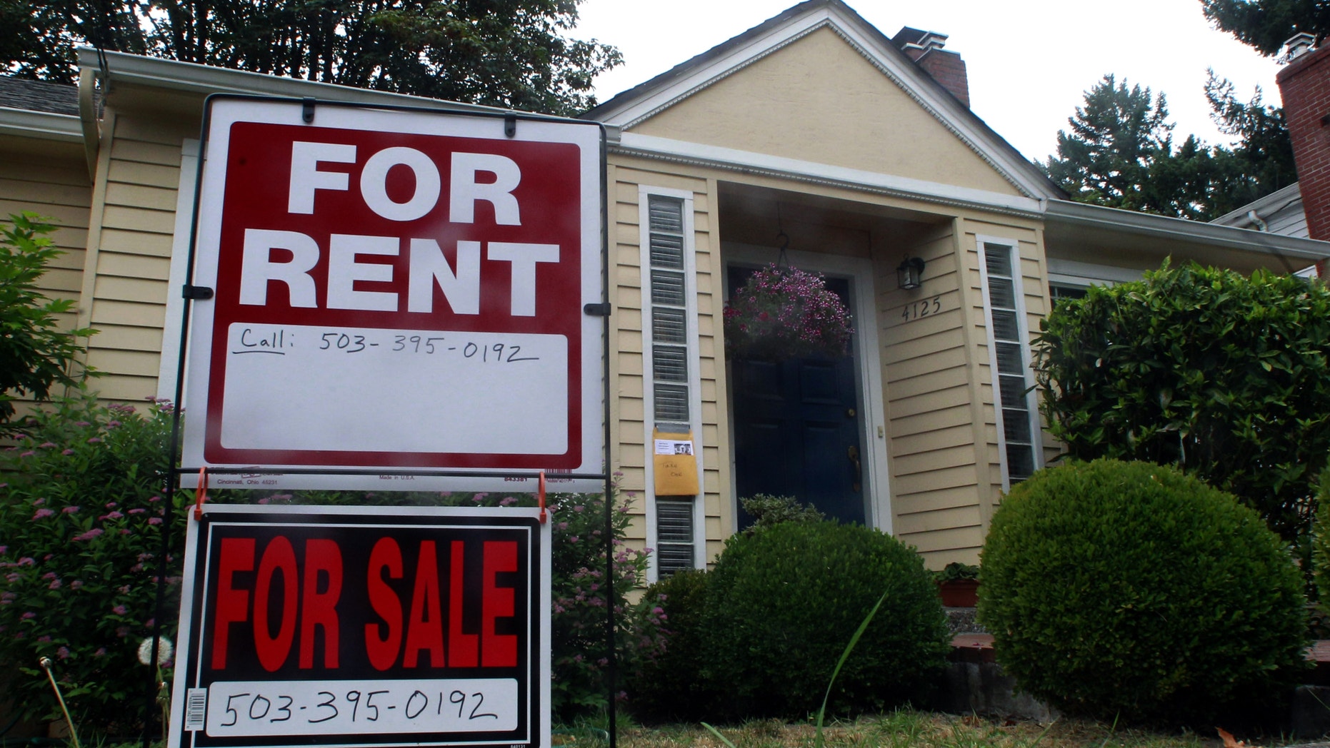 FILE - In this Sept. 13, 2011, file photo, a house is for rent an for sale in Portland, Ore. Experts say owning rental housing can pay off even as market recovers. (AP Photo/Rick Bowmer, File)
